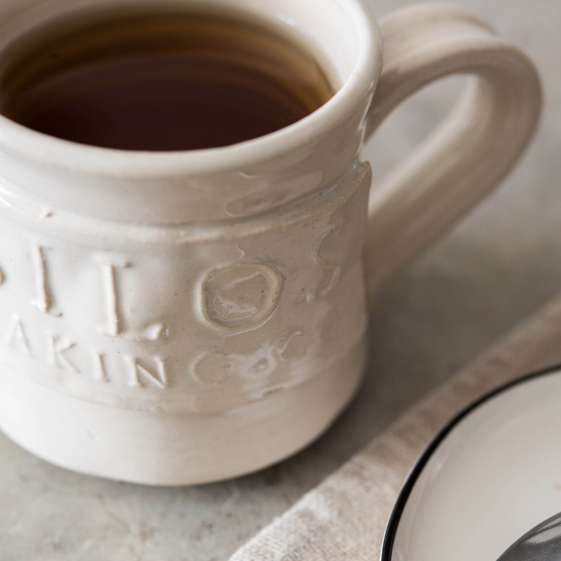 hand thrown coffee mug with silos baking co logo