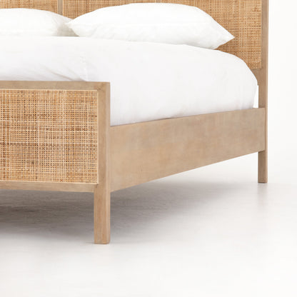modern natural washed wooden bed with cane detailed headboard and footboard