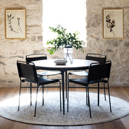 modern metal dining chair with distressed black leather seat and back