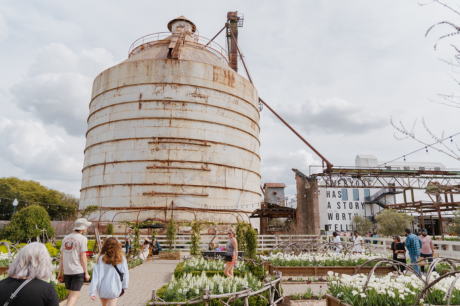 A flourishing garden around the Magnolia Silos in Waco, Texas.
