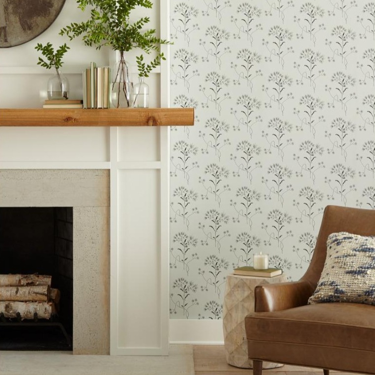 Magnolia Wallpaper in wildflower print shown on wall next to fireplace