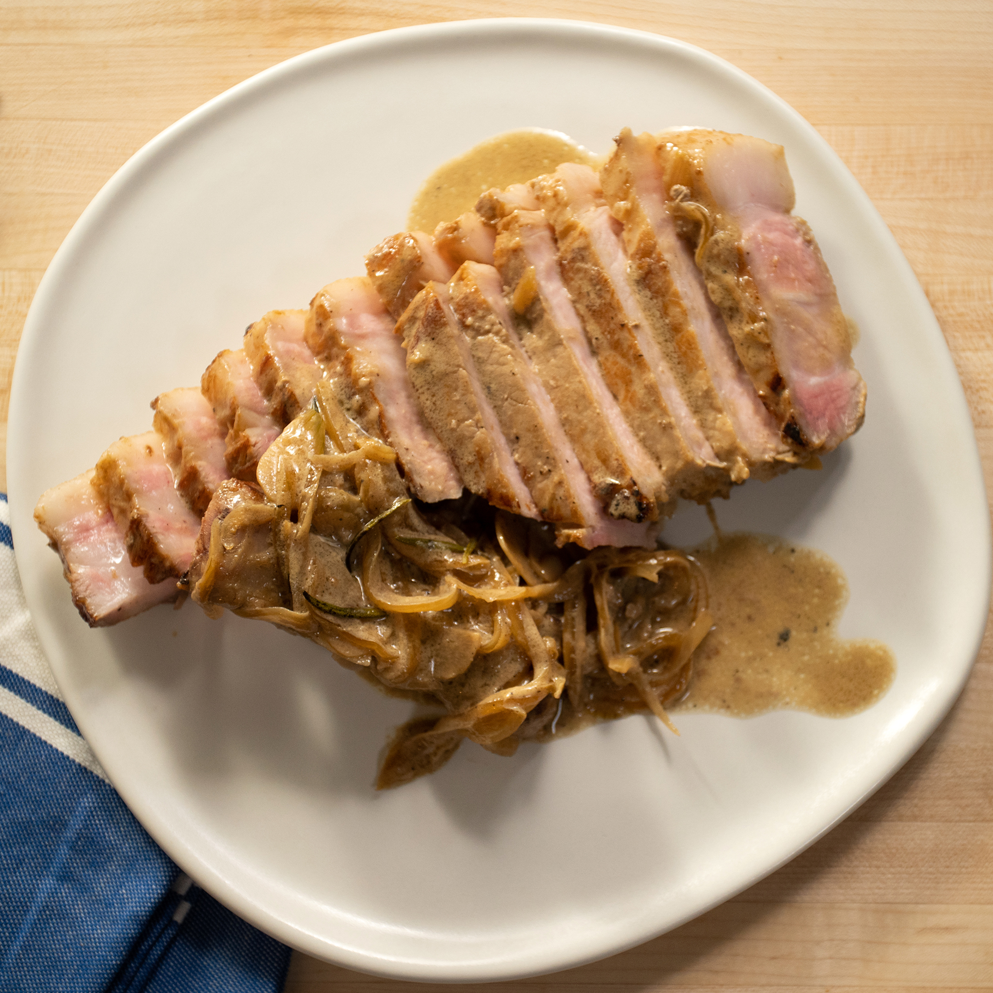 Katie Button's Pork Chops in Rosemary-Mustard Cream Sauce