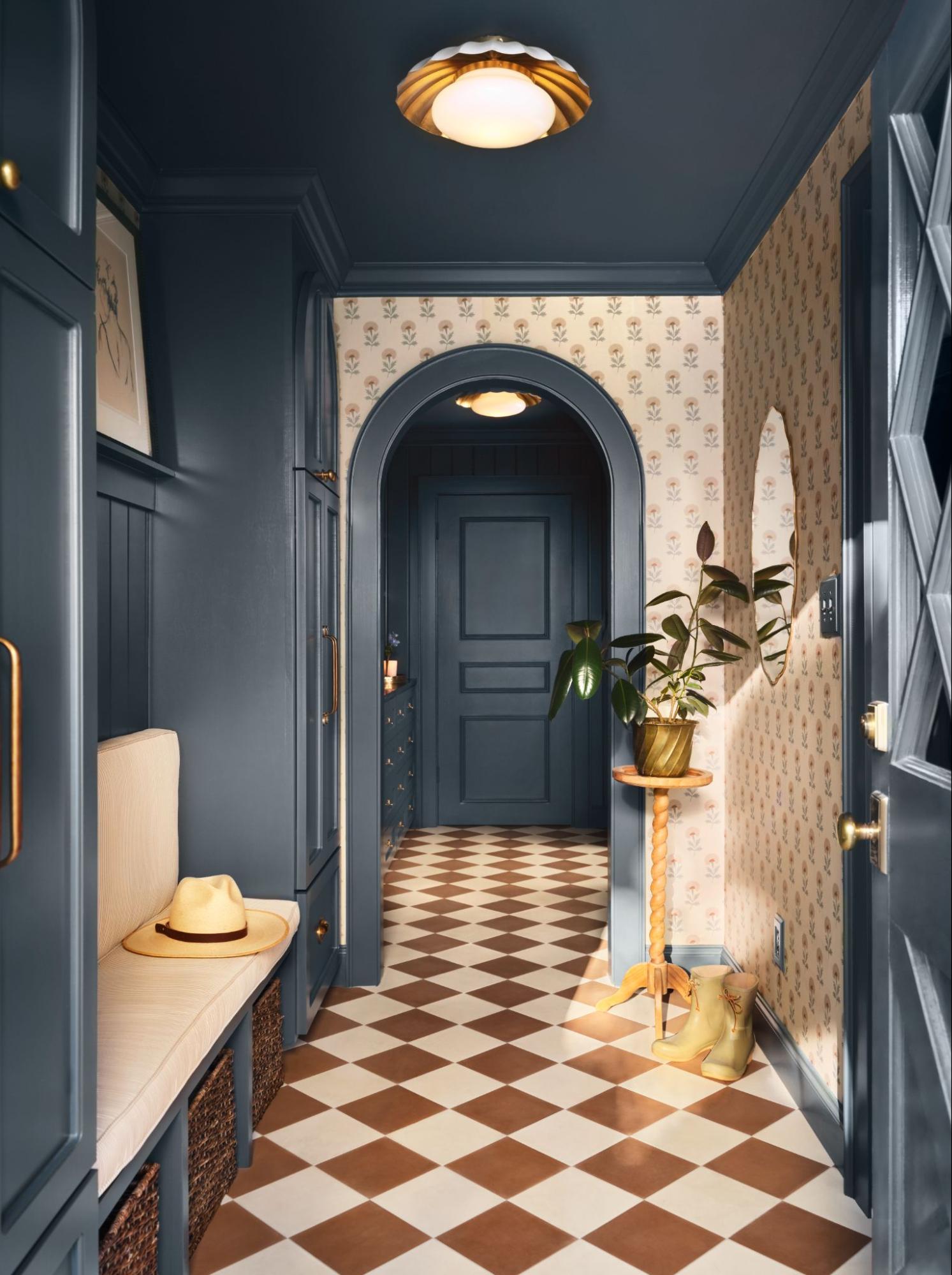 A moody mudroom with a built-in bench seat, as seen on Mini Reni.