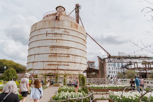 A flourishing garden around the Magnolia Silos in Waco, Texas.