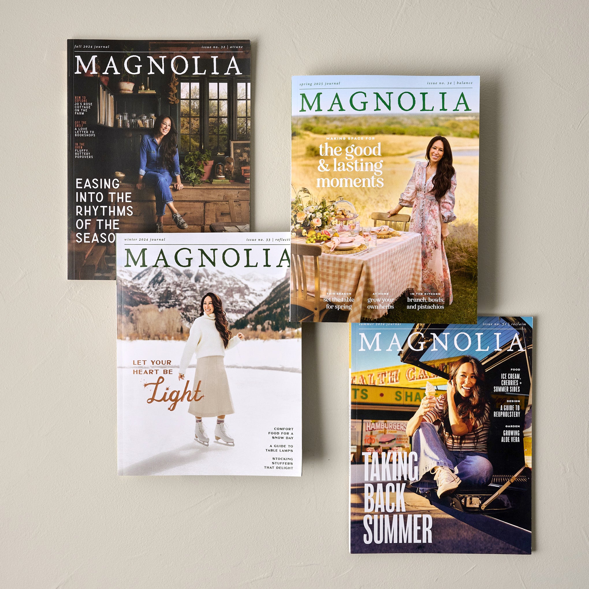 Magnolia Journal Spring 2025 shown with other magnolia journals
