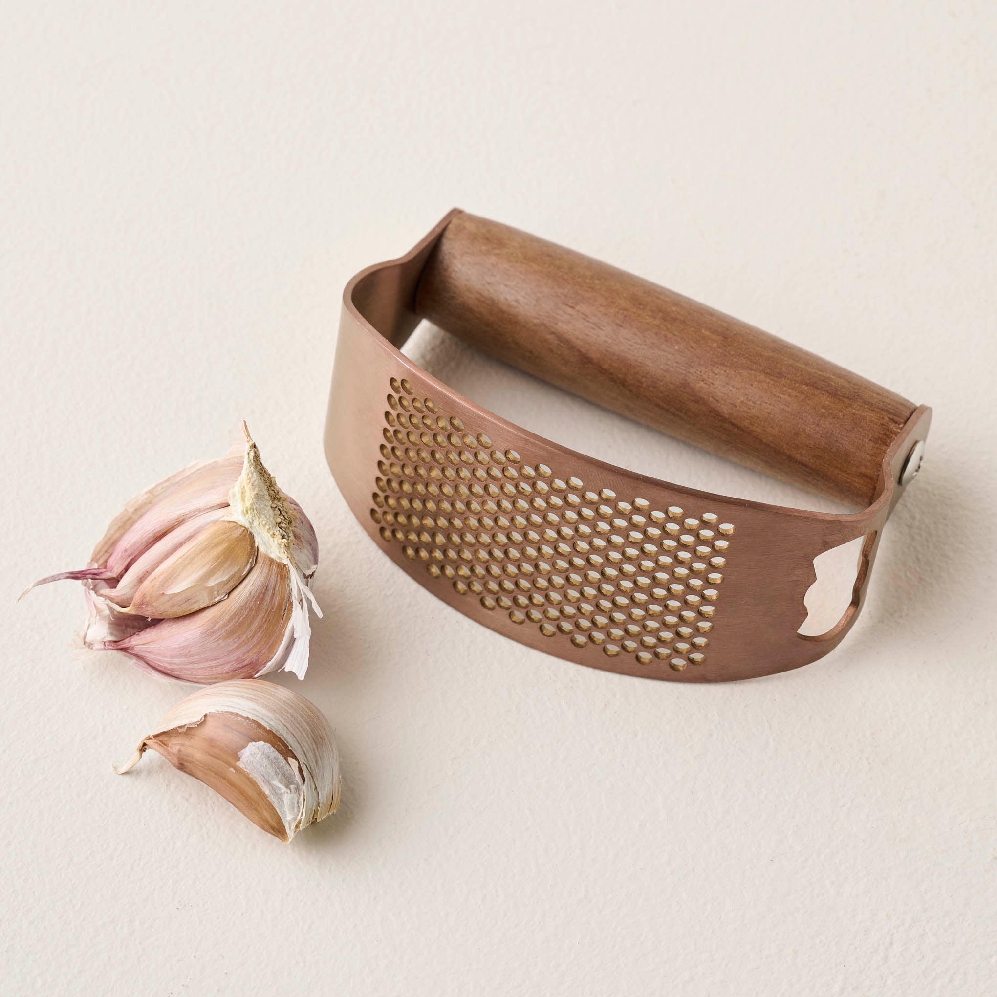 Copper and Walnut Garlic Rocker shown with garlic $18.00