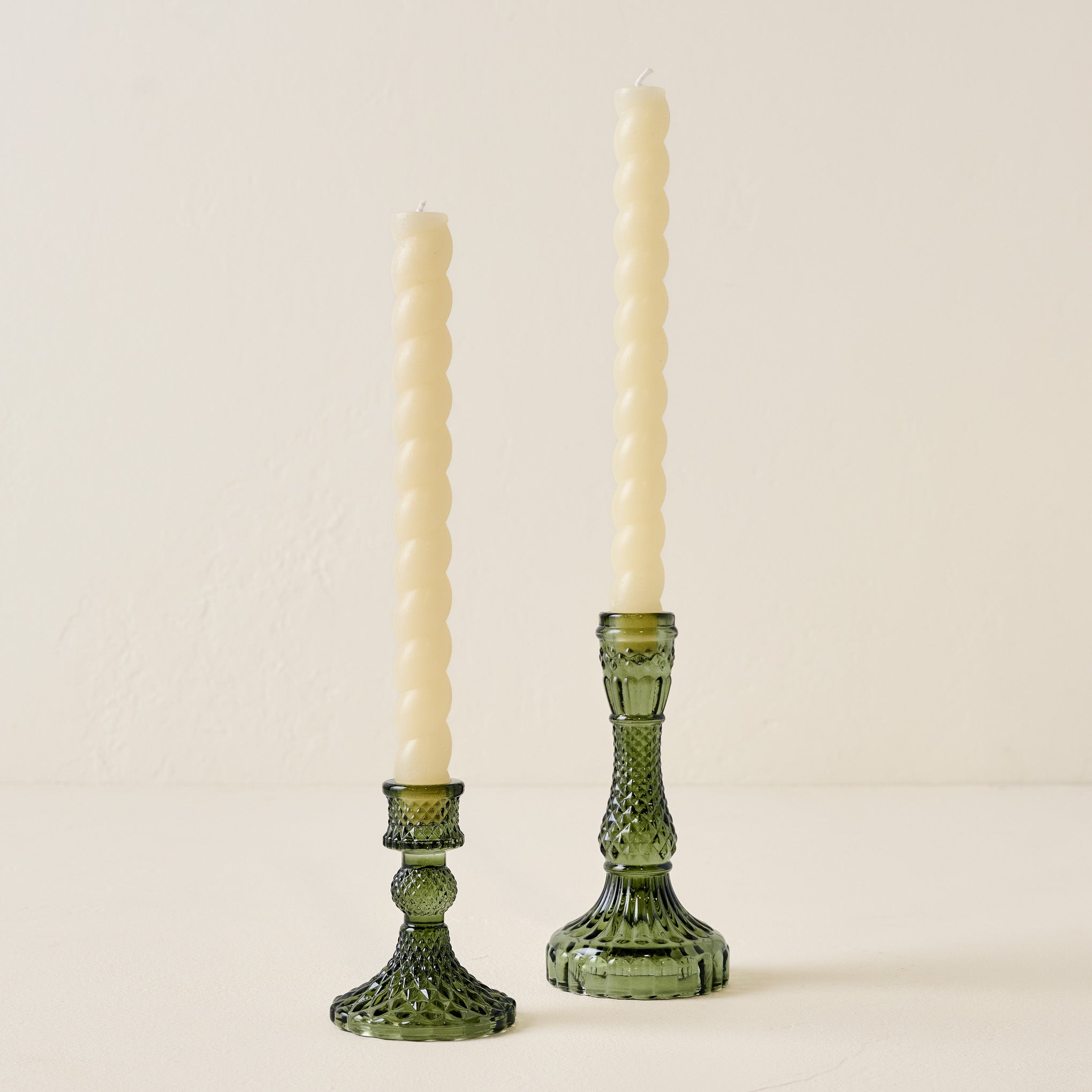 Antique Green Glass Taper Holder shown with twisted tapers Items range from $14.00 to $16.00