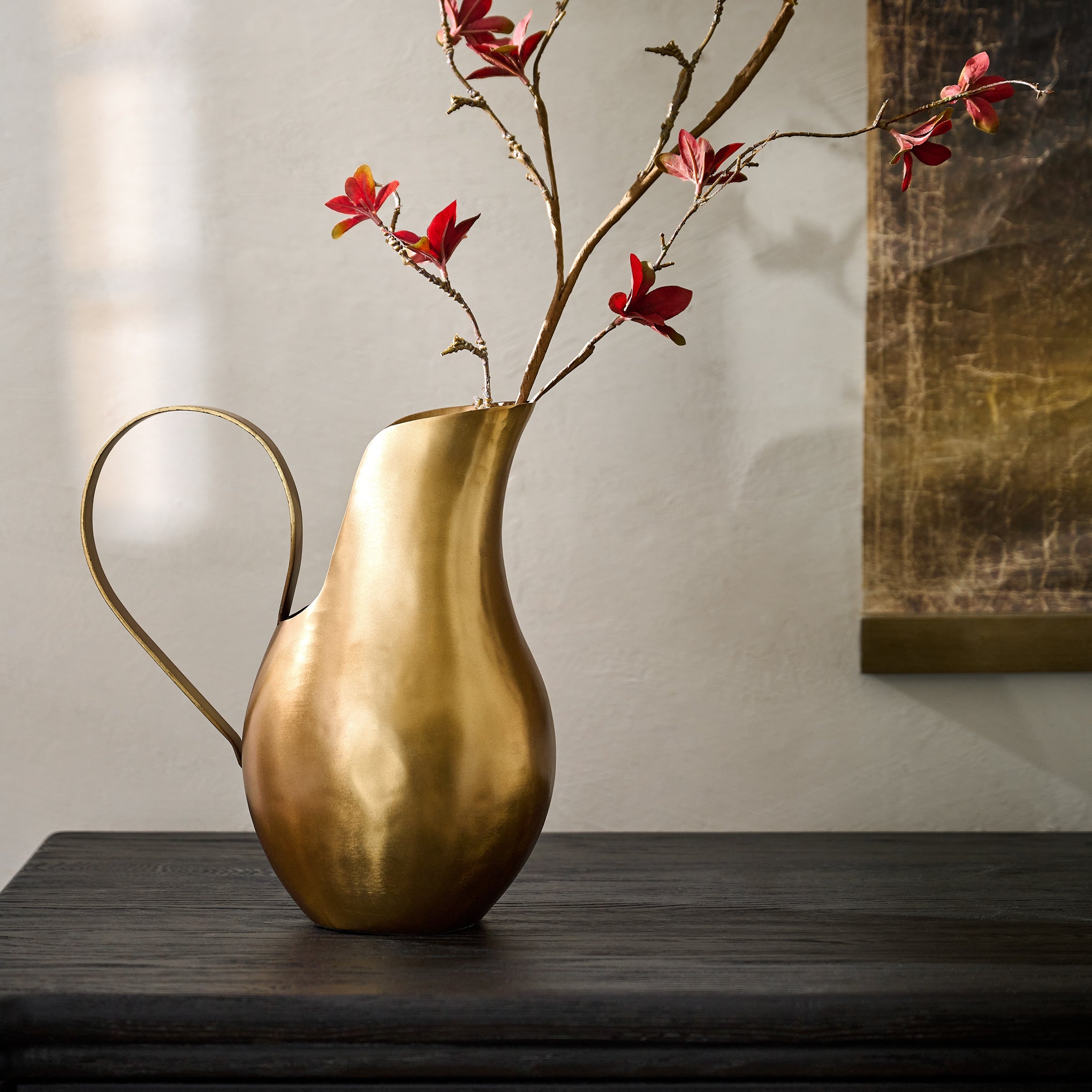 Antique Brass Pitcher Vase shown on table with florals $98.00