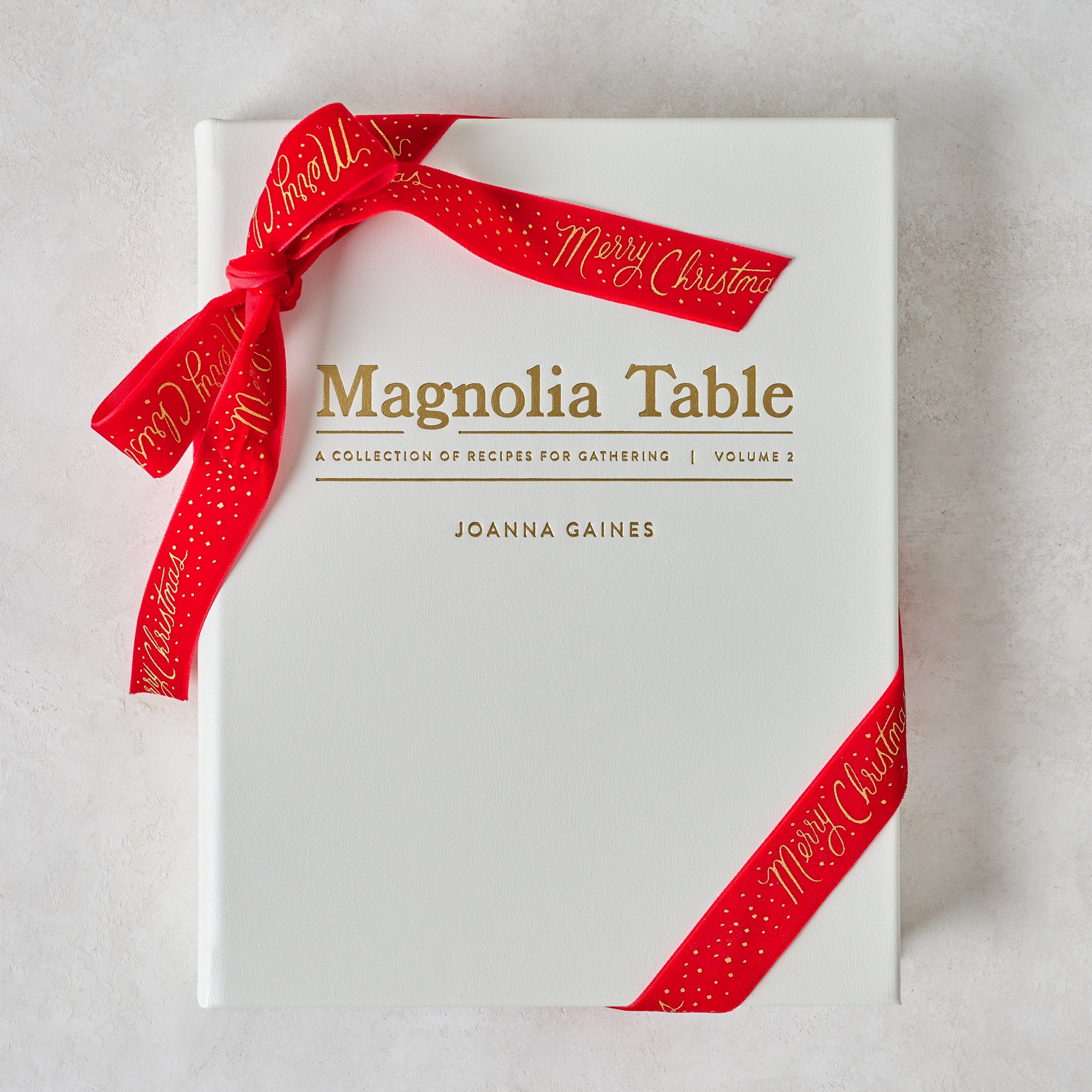 Leather Bound Magnolia Table, Volume 2 shown with ribbon $135.00
