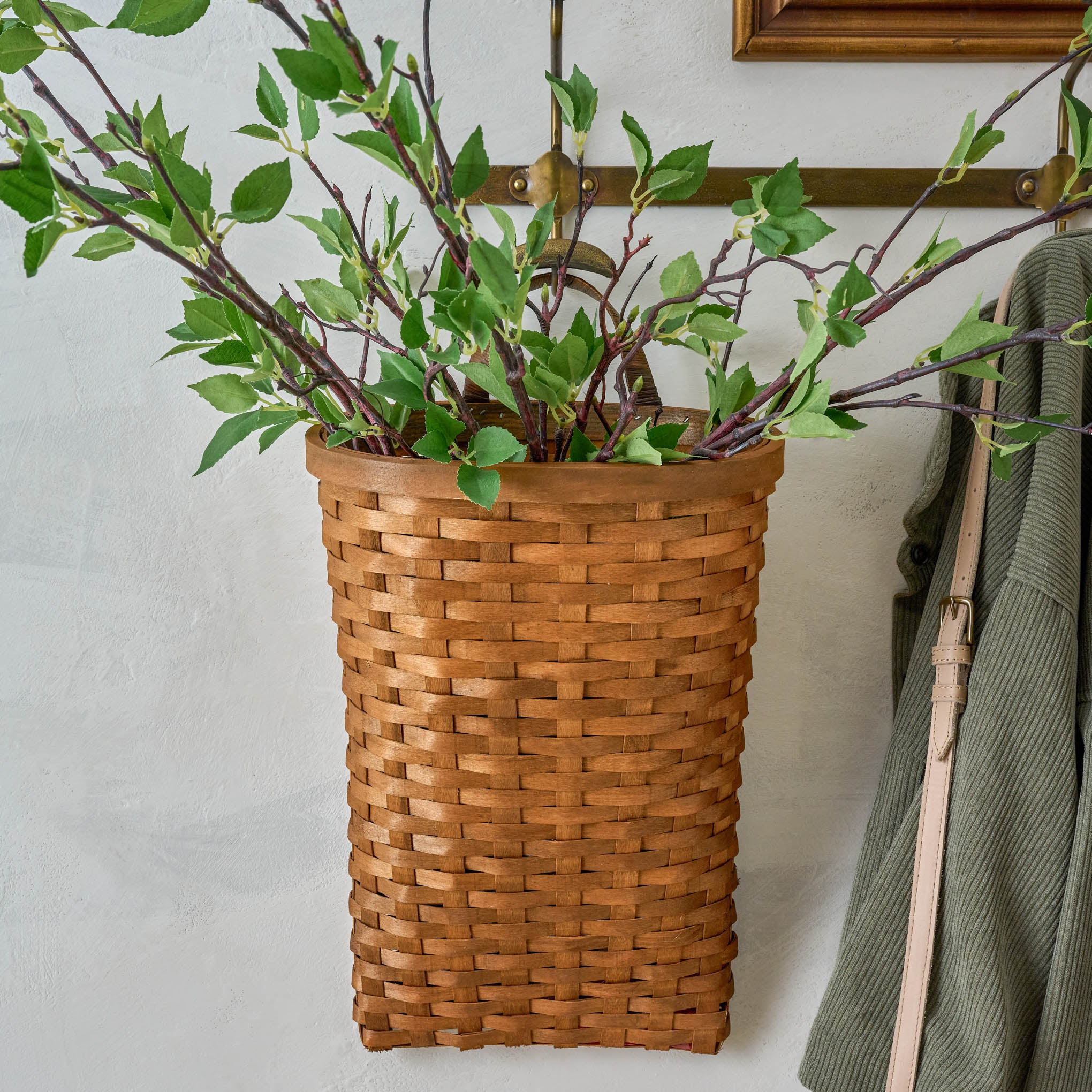 Warren Hand Woven Wall Basket with greenery inside $32.00