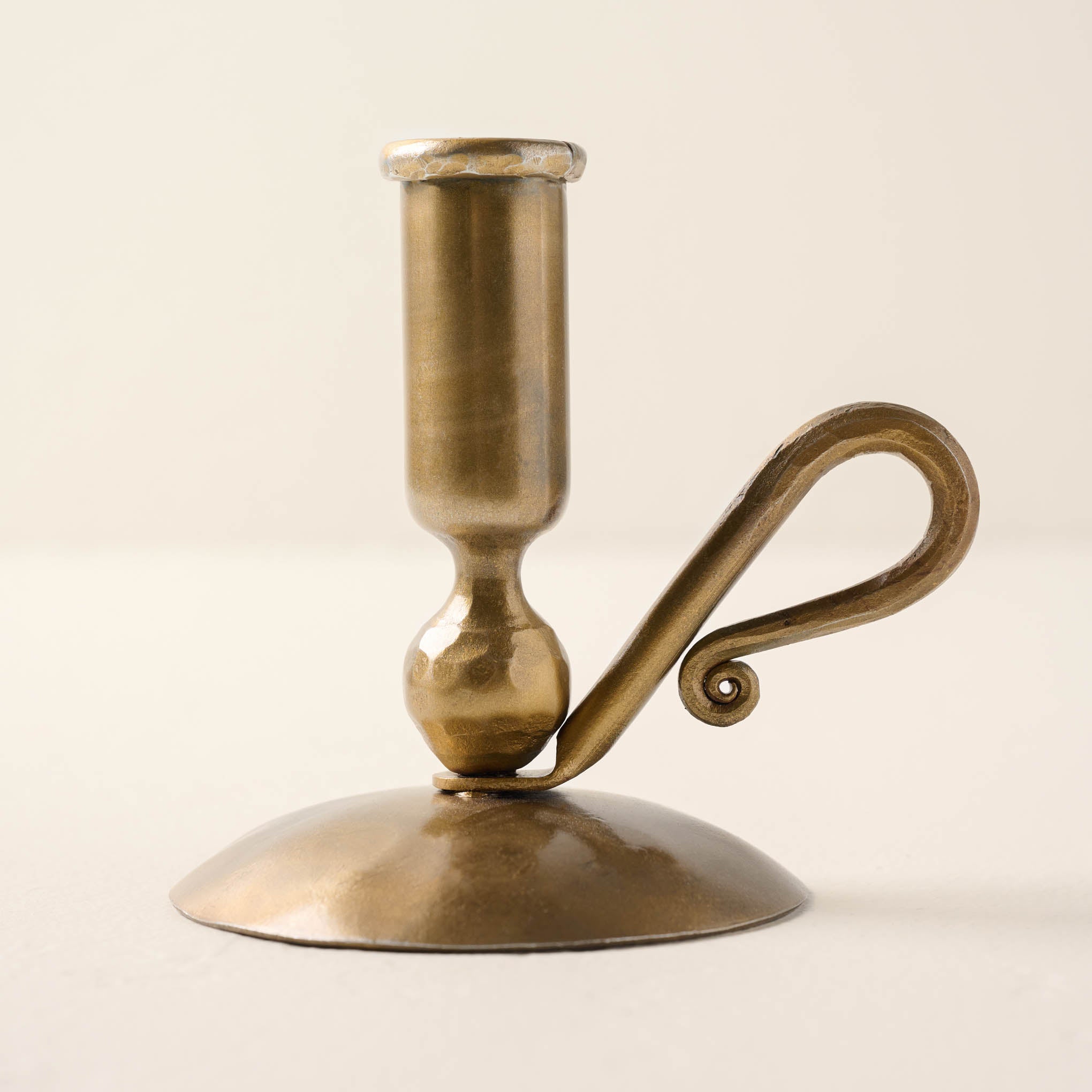 brass wright taper holder with curved handle