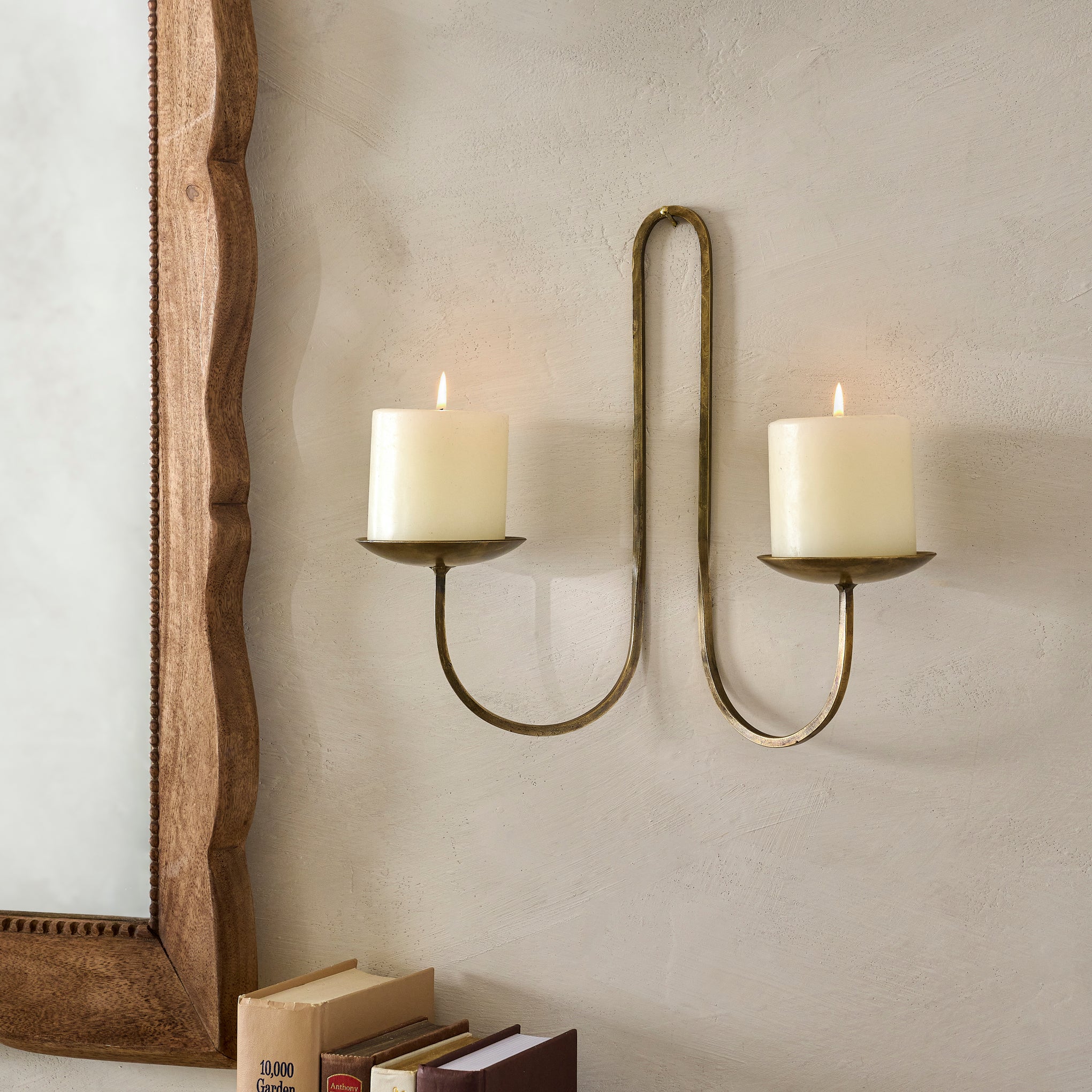 Daniel Antique Brass Candle Sconce shown with candles $34.00