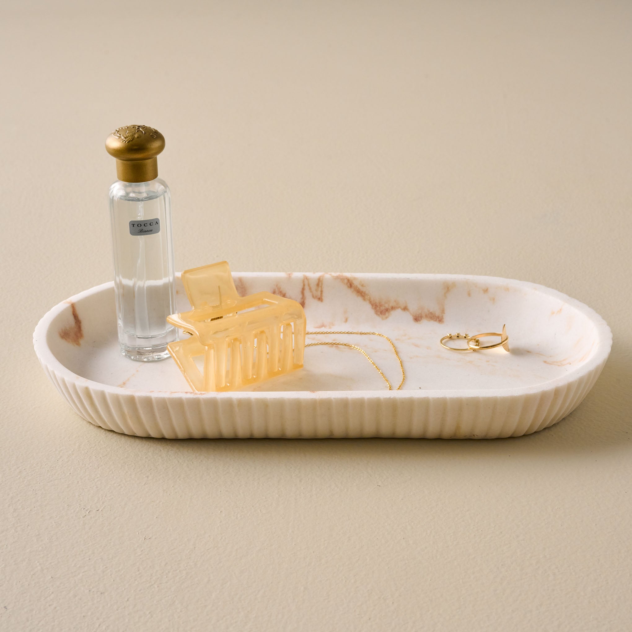 Fluted Quartz Tray holding trinkets On sale for $14.99, discounted from $18.00