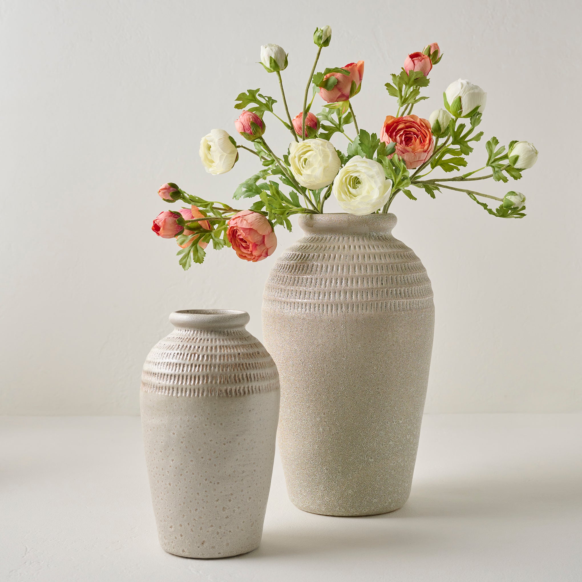 Sawyer Rustic Cream Vases shown with florals Items range from $34.00 to $64.00