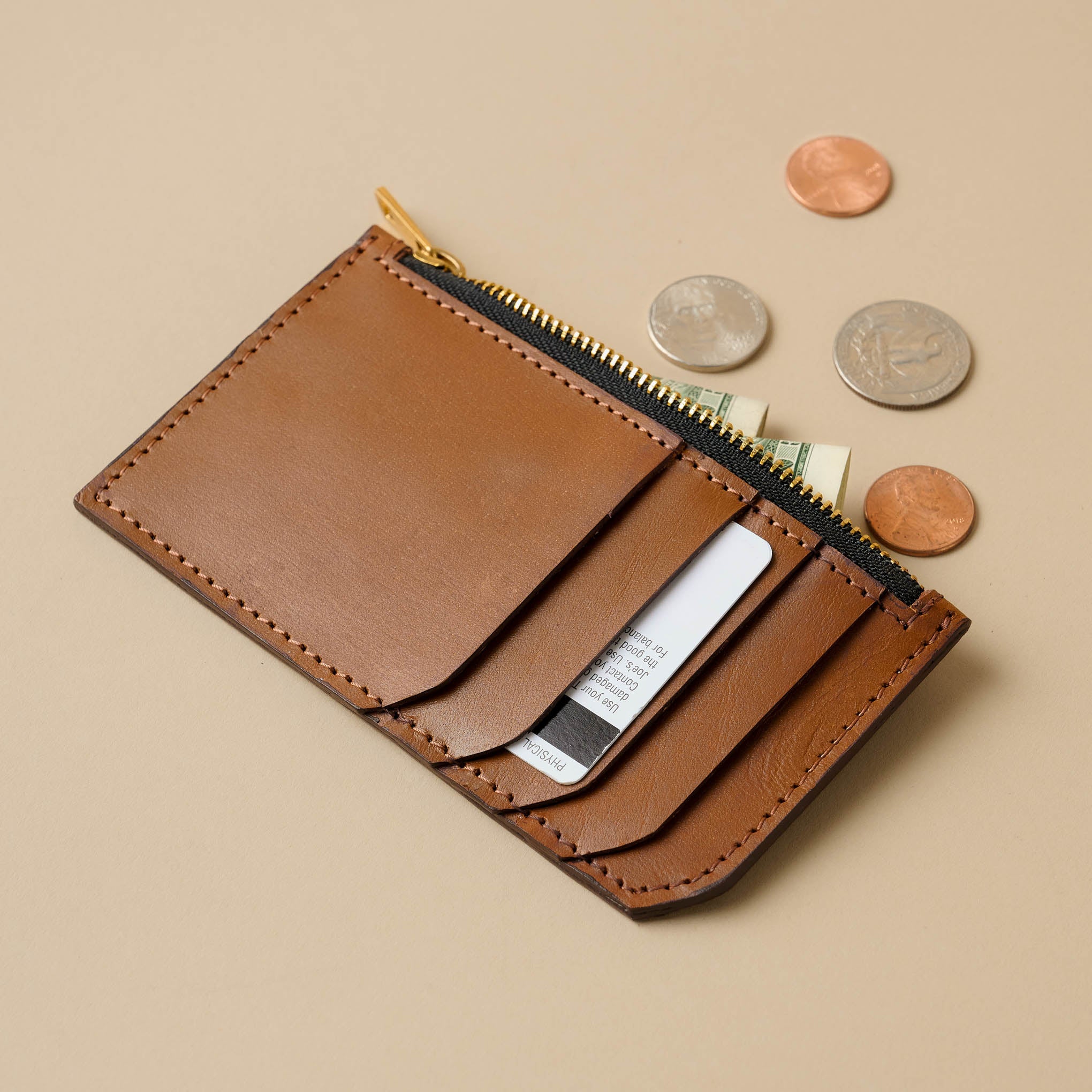Magnolia Essential Caramel Card Holder with cards and coins On sale for $39.99, discounted from $68.00