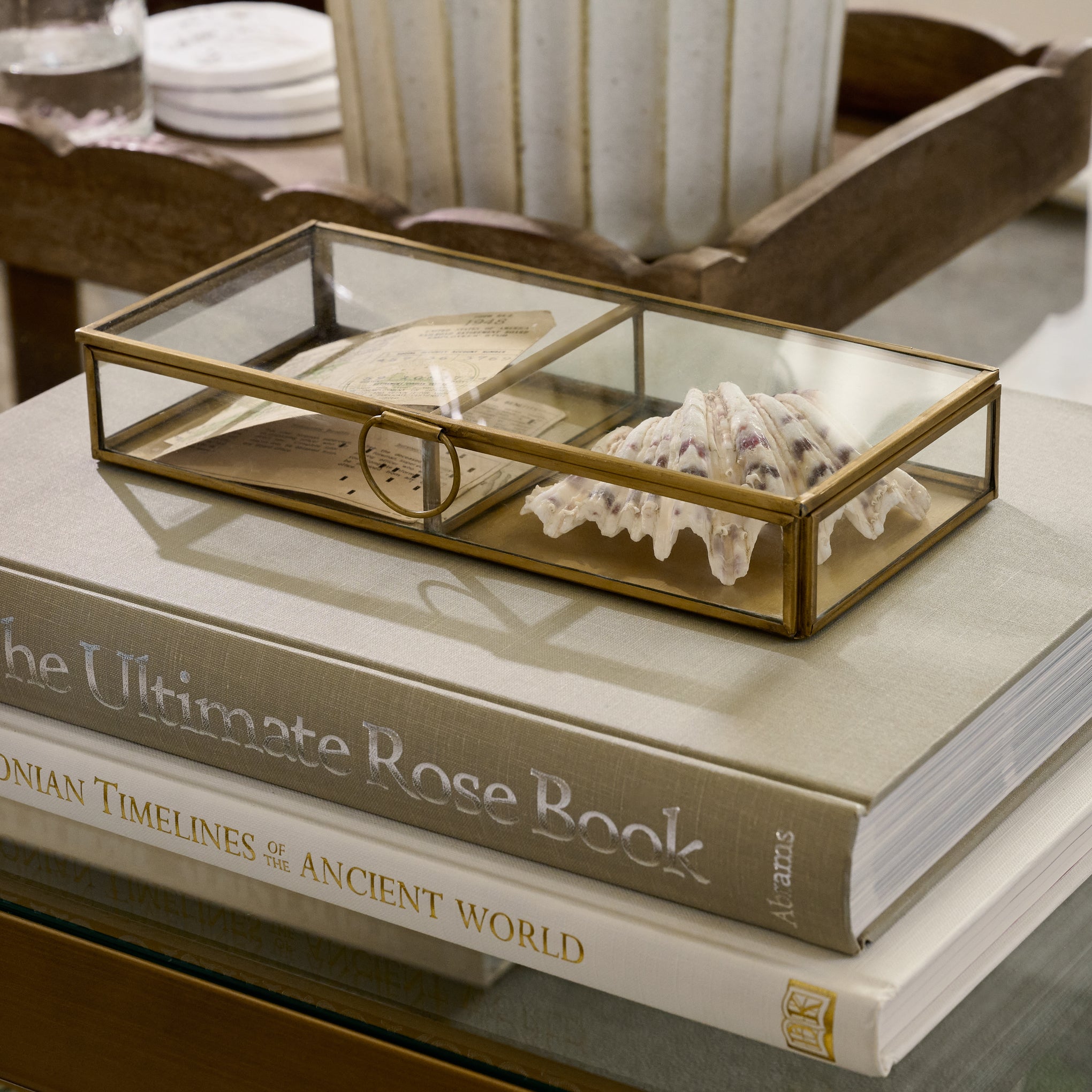 Antique Brass Keepsake Box on top of stacked books with a seashell inside $34.00