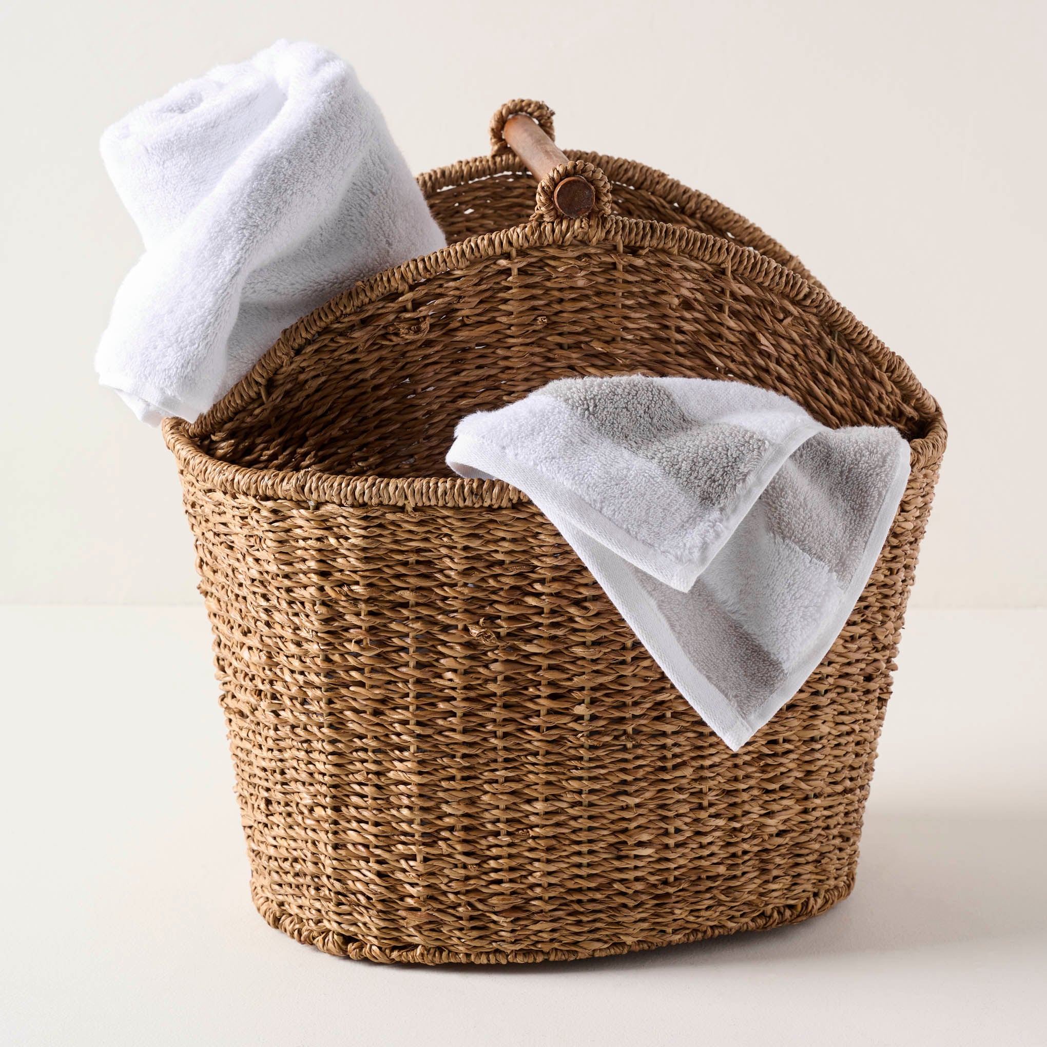 Bath Wicker Basket shown with towels inside