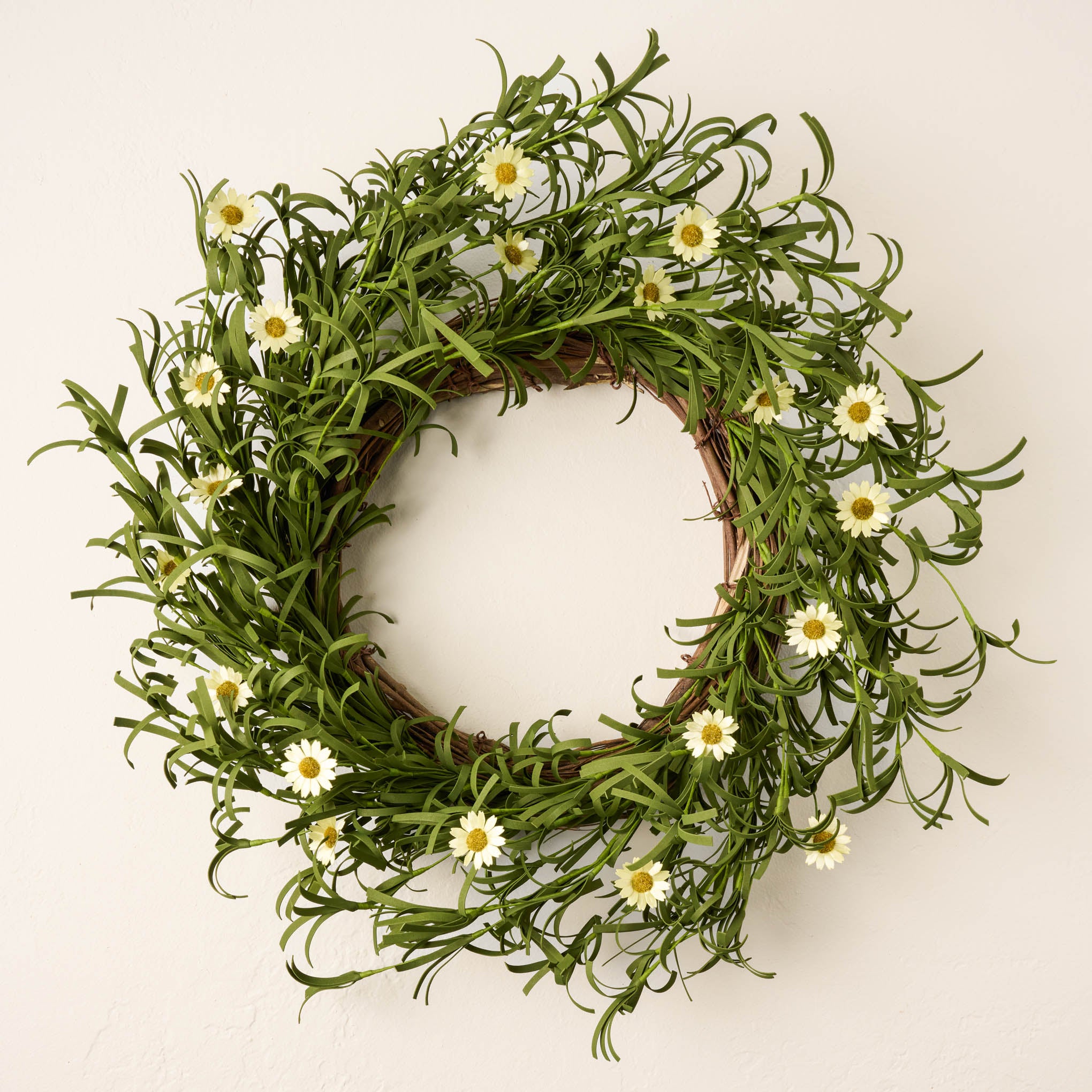 leafy green wreath with small faux daisies