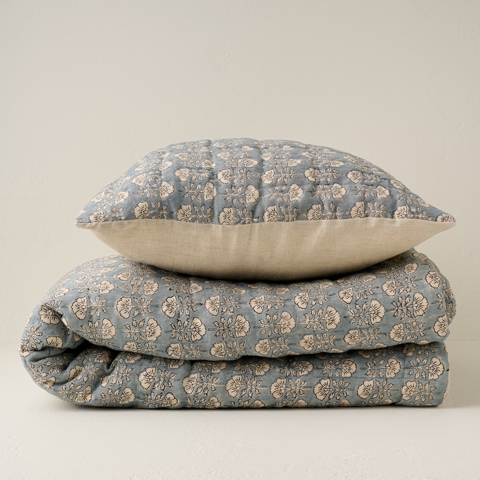 Stacked Flora Block Silver Blue Print Quilt and Pillow Sham Items range from $250.00 to $300.00