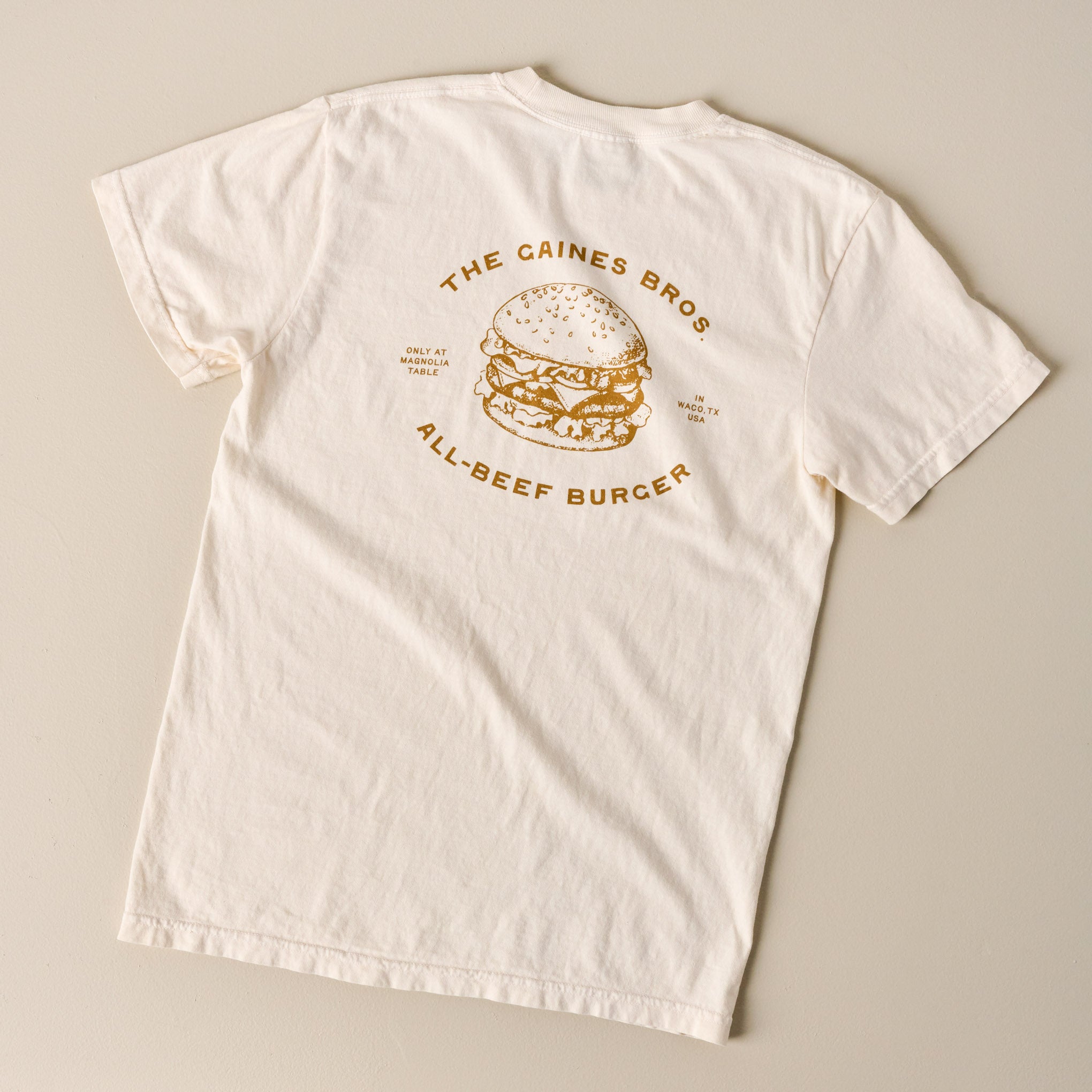 Back of Gaines Bros Burger Ivory Tee $32.00