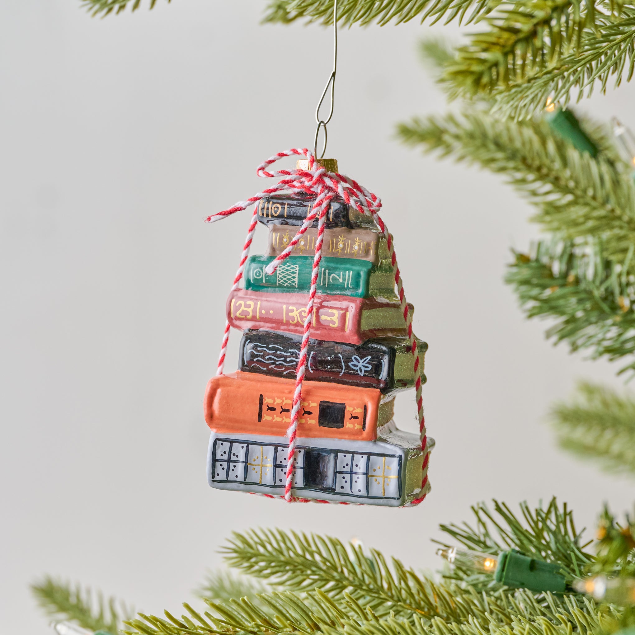 Bookstack Ornament shown on tree