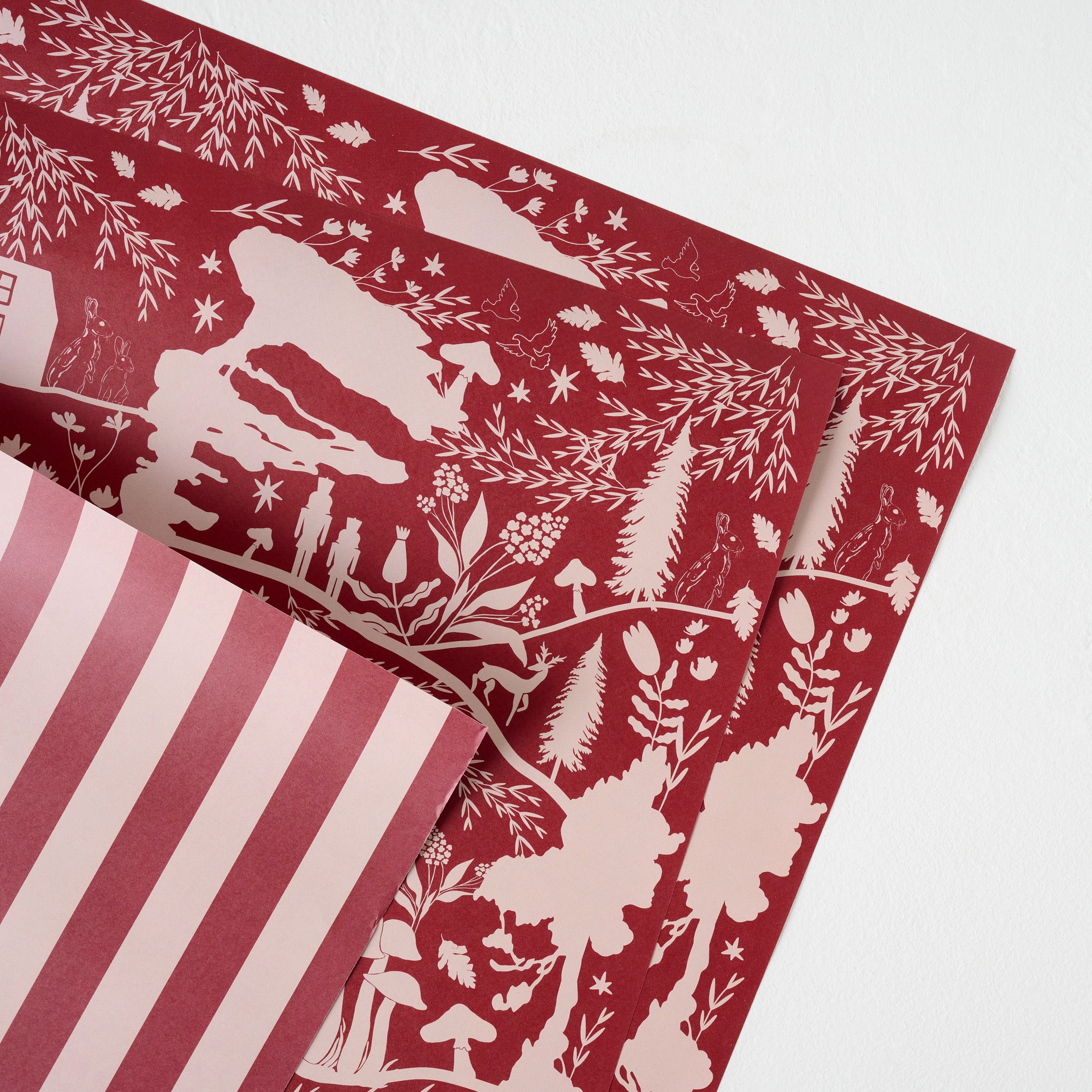 Magnolia Burgundy Woodland Wrapping Paper Sheets up close On sale for $9.99, discounted from $15.00