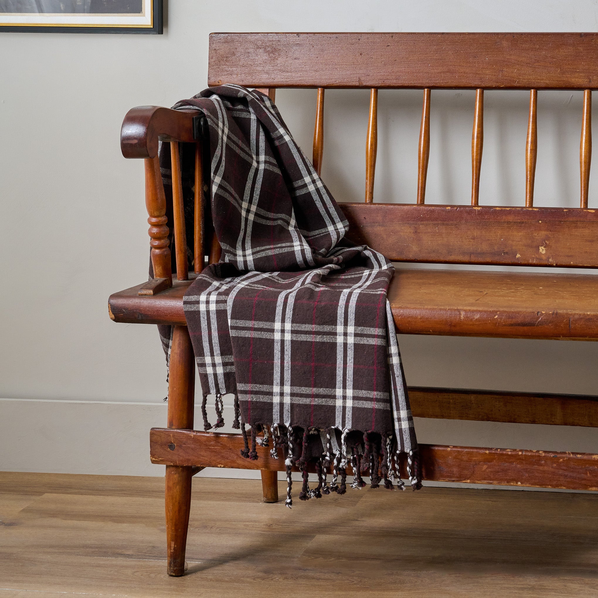 Chestnut Harmony Throw shown draped over wooden bench