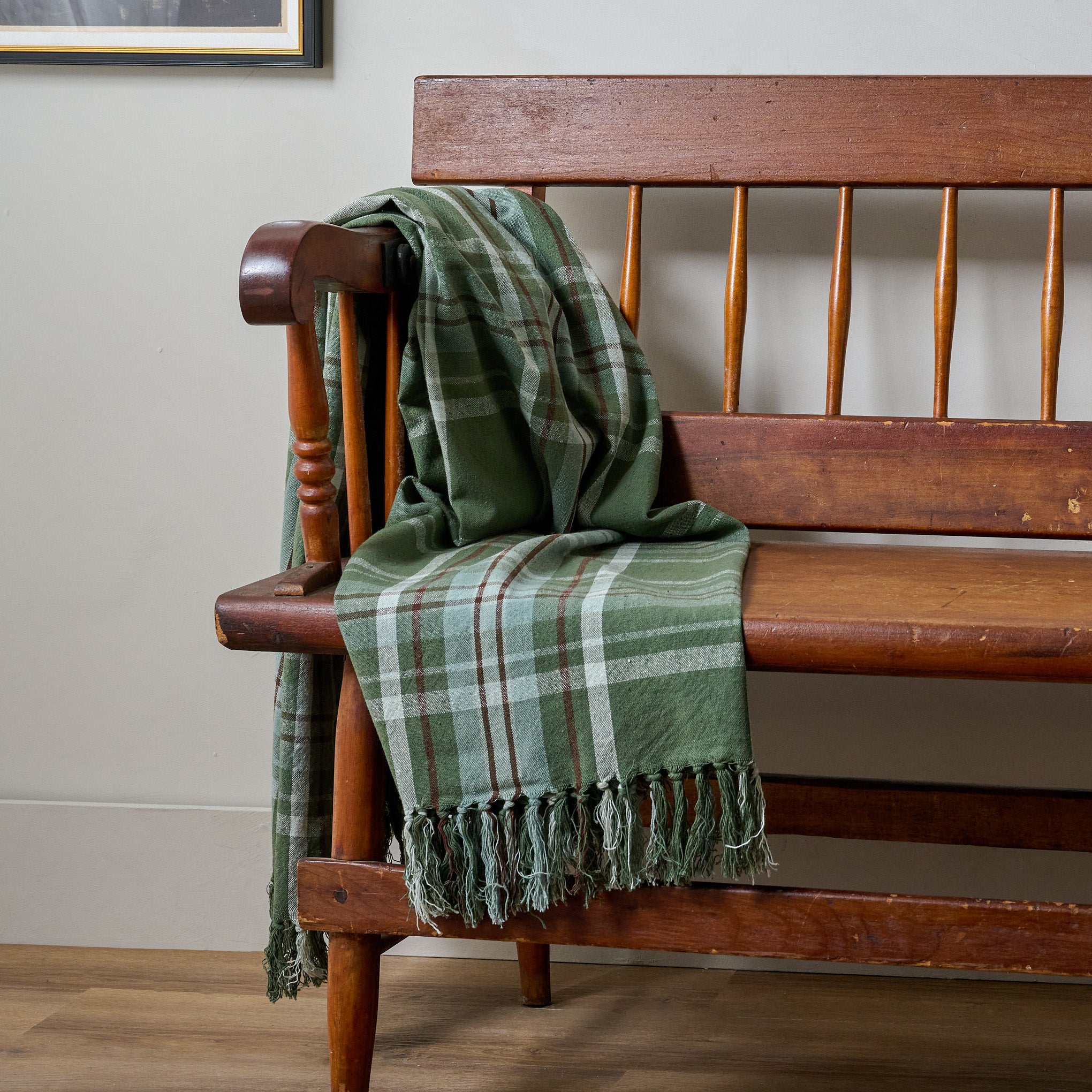 Winter Harmony Throw shown draped over wooden bench