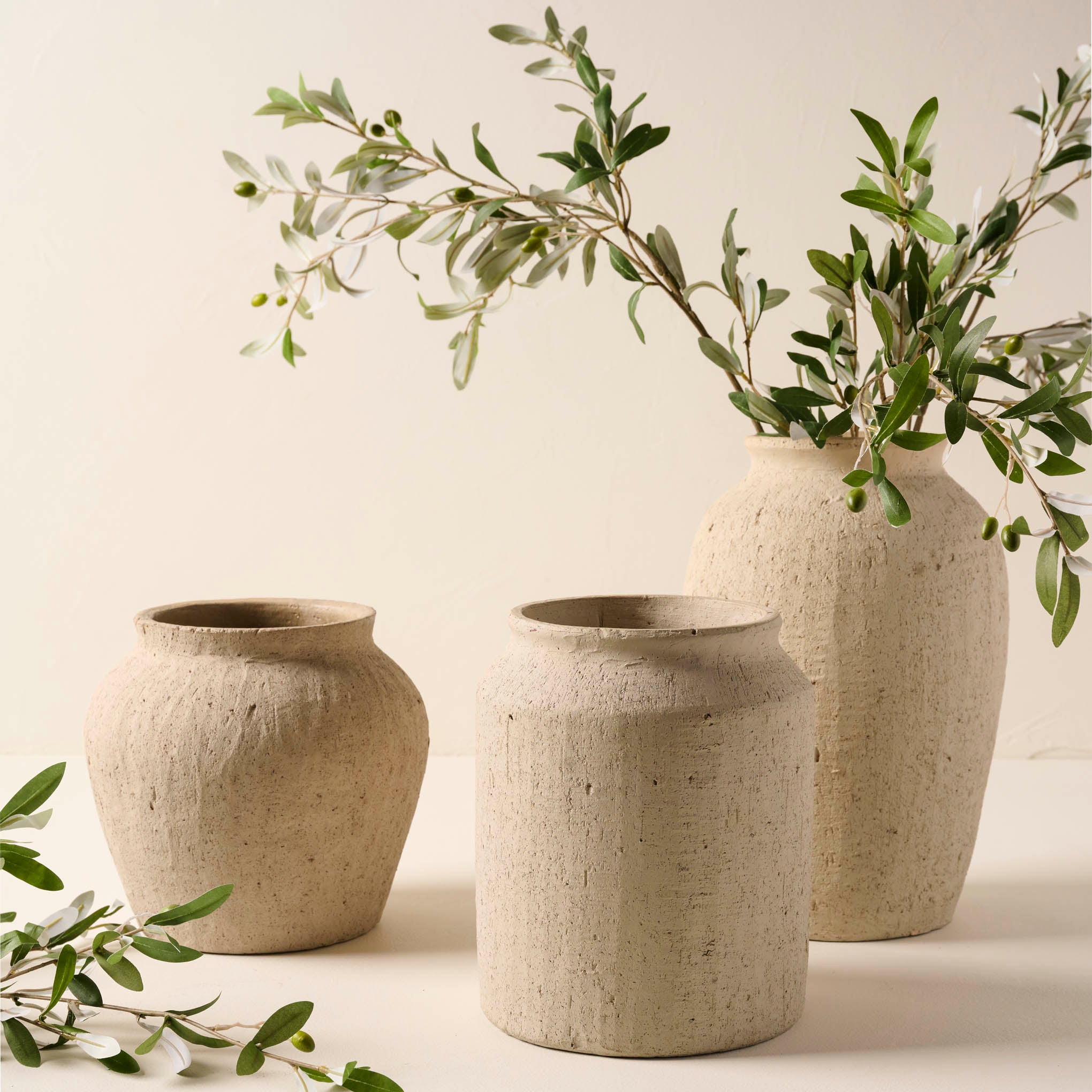 Small Textured Adrienne Vase in all 3 shapes with olive branches Items range from $24.00 to $42.00