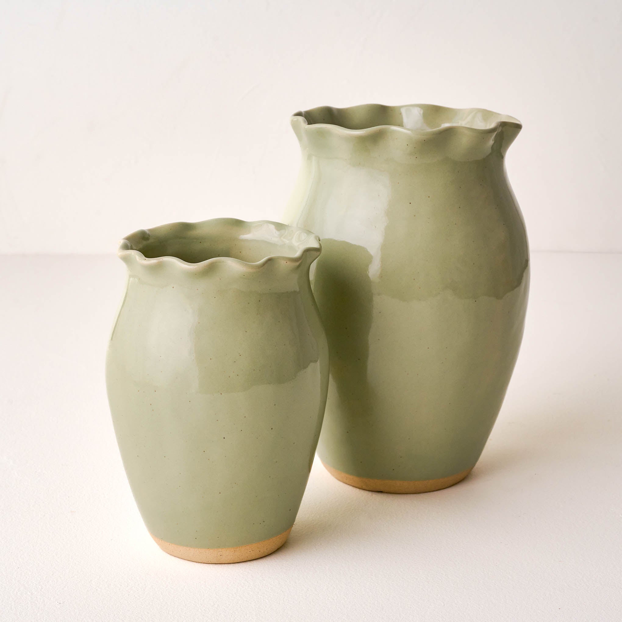 Nancy Green Scalloped Ceramic Vases On sale with items ranging from $14.99 to $24.99, discounted from $20.00 to $32.00