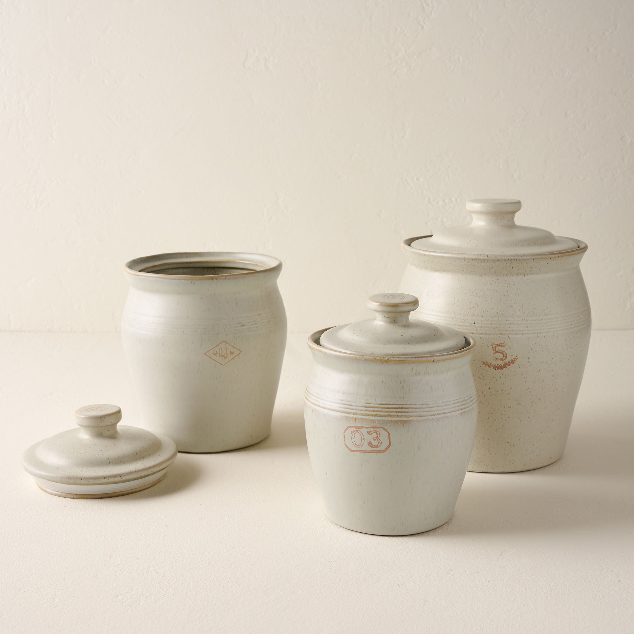 French Grey Embossed Stripe Canisters Items range from $30.00 to $44.00