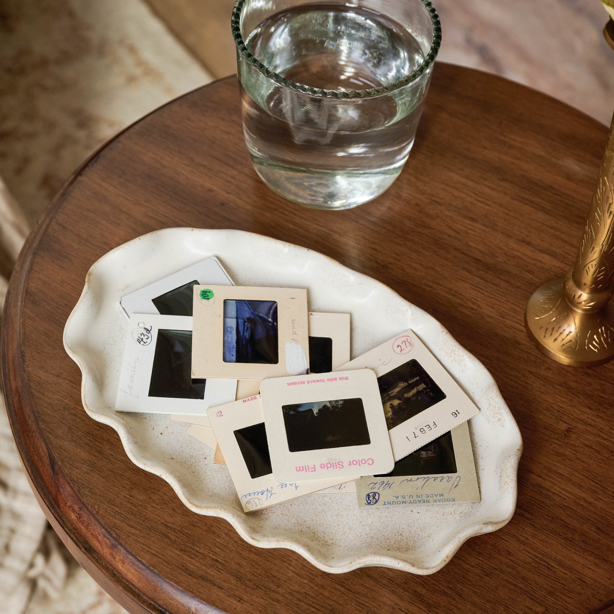 Ceramic Ruffled Tray on a table with photos on top $28.00