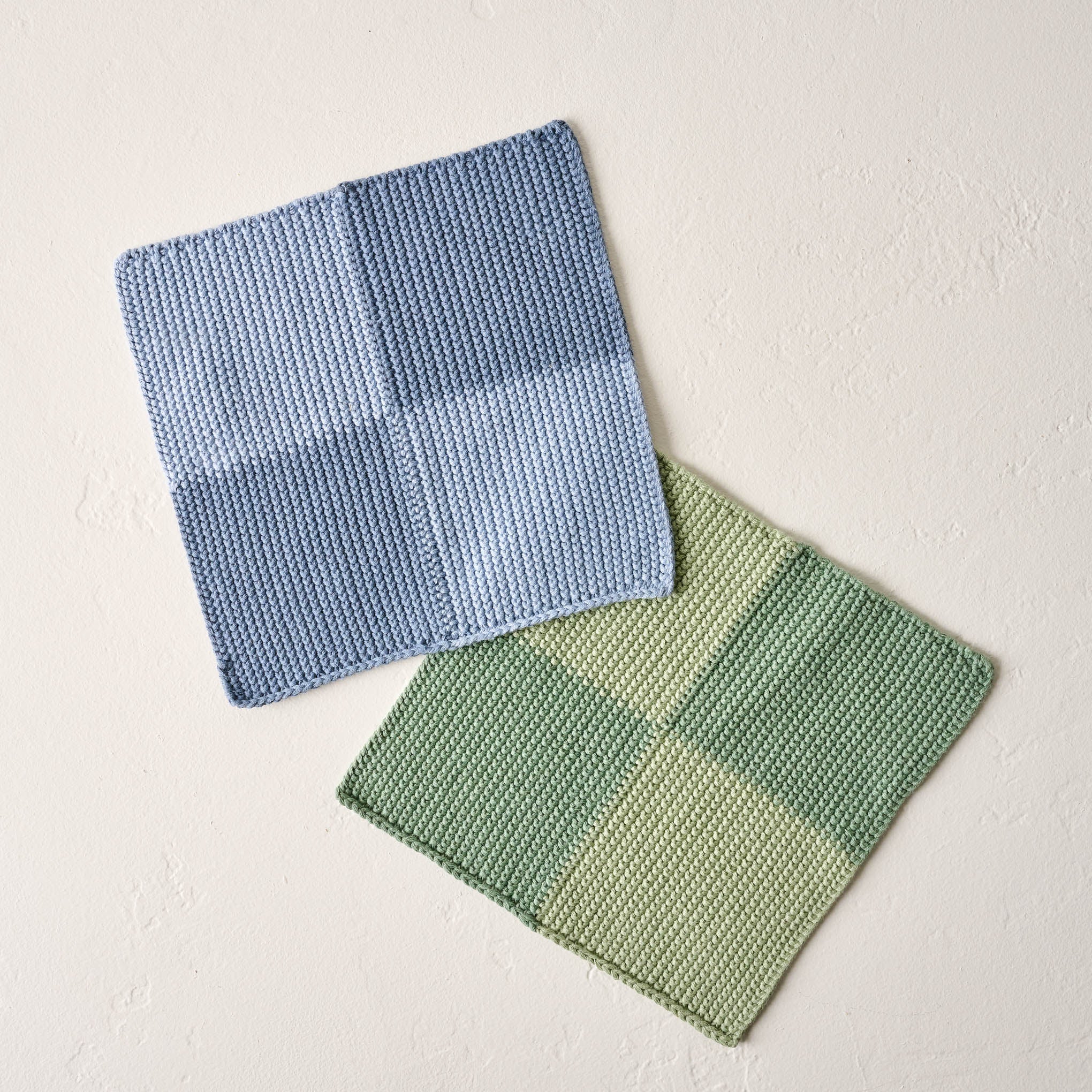 two cotton knitted washcloths in blue checkerboard and green checkerboard On sale for $12.00, discounted from $20.00