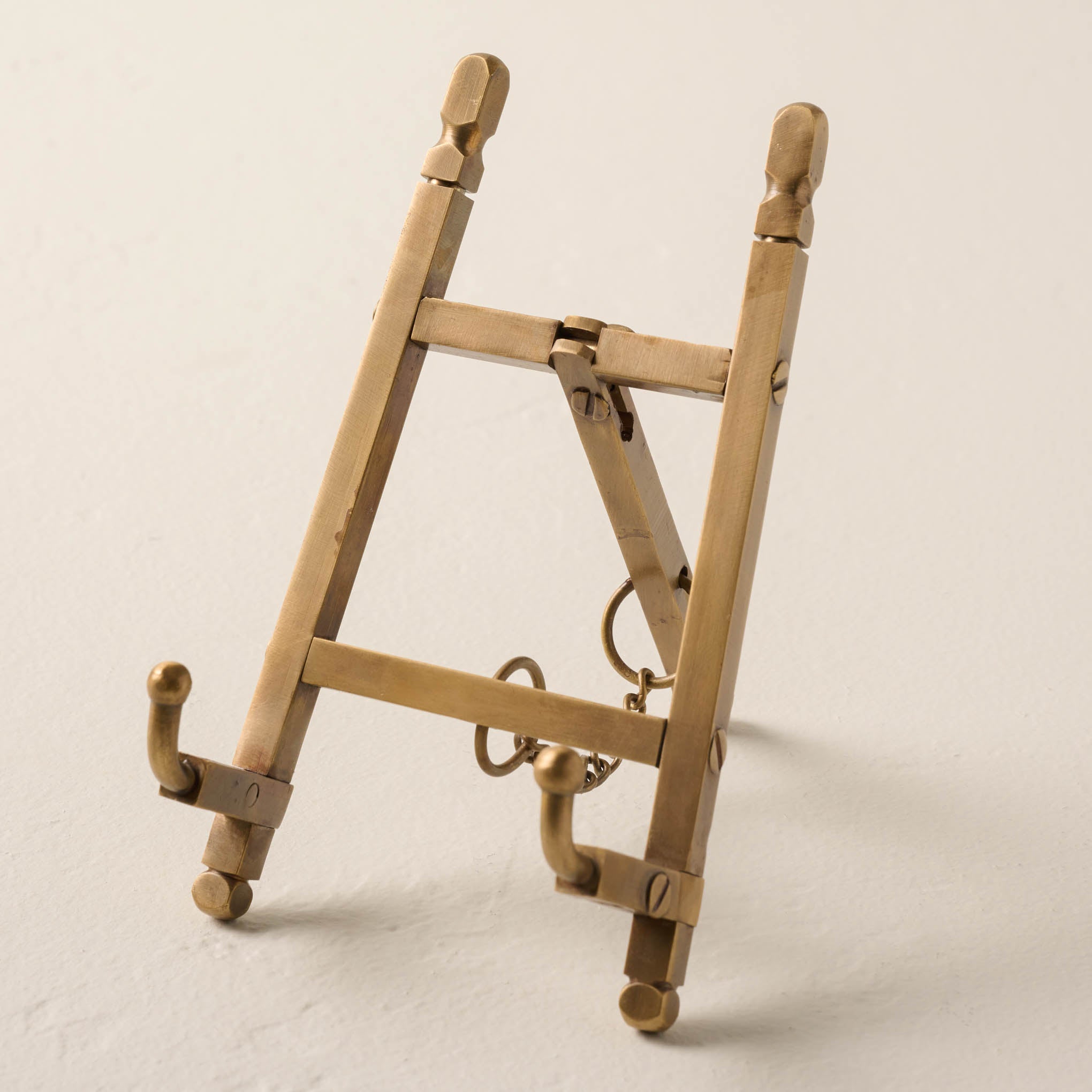foldable brass shelf easel