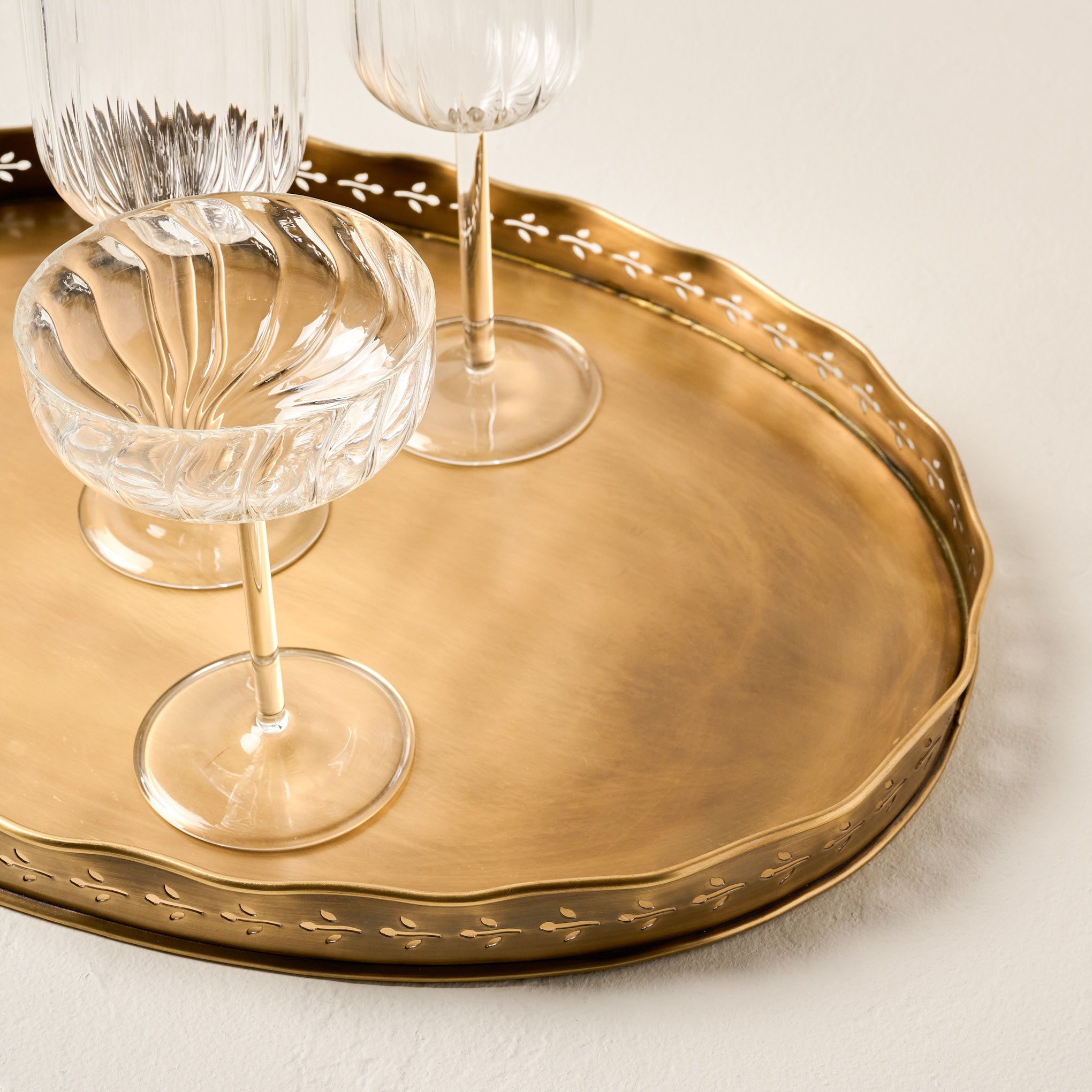Floral Antique Brass Tray shown with empty glasses on top $64.00