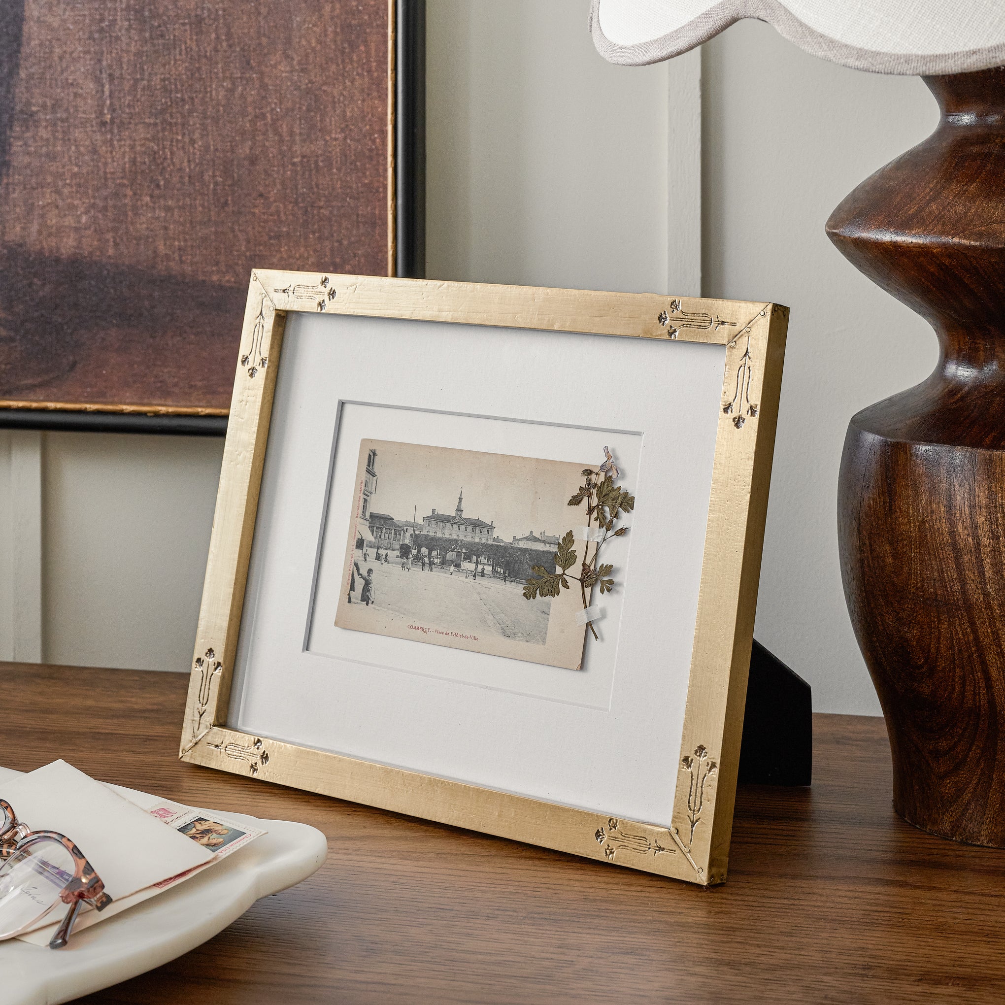 Floral Antique Brass Photo Frame shown on table Items range from $30.00 to $32.00