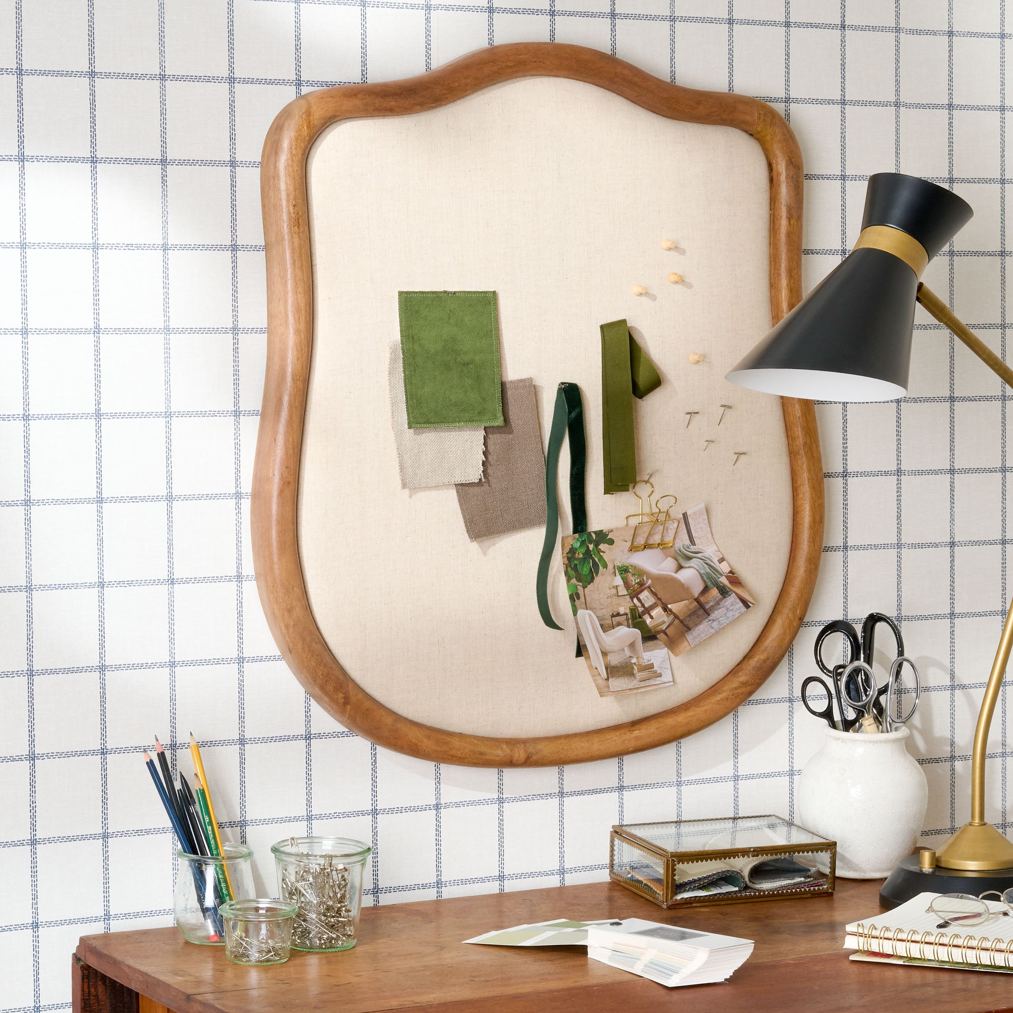Maya Linen Upholstered Pinboard on a wall with pins, pictures and cloth pinned on board On sale for $49.99, discounted from $98.00