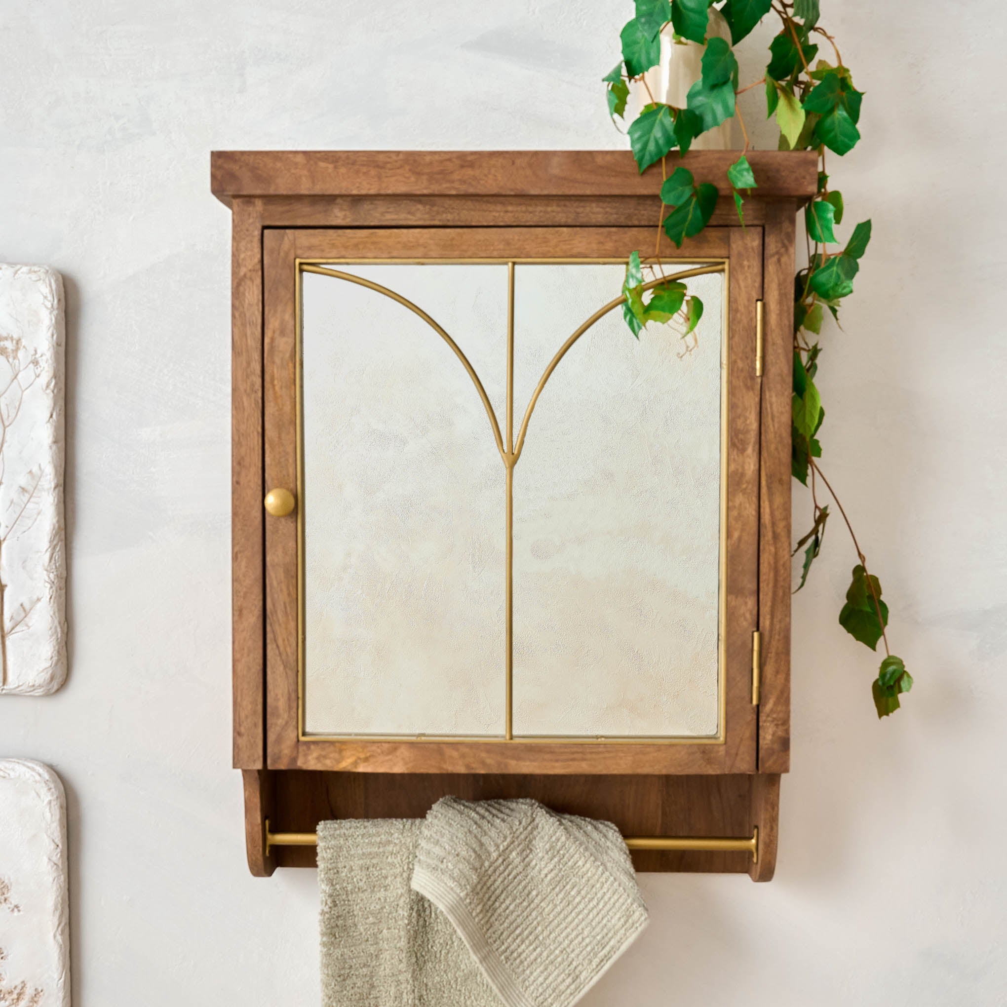 Gristmill Mirrored Wall Cabinet with plant on top $198.00