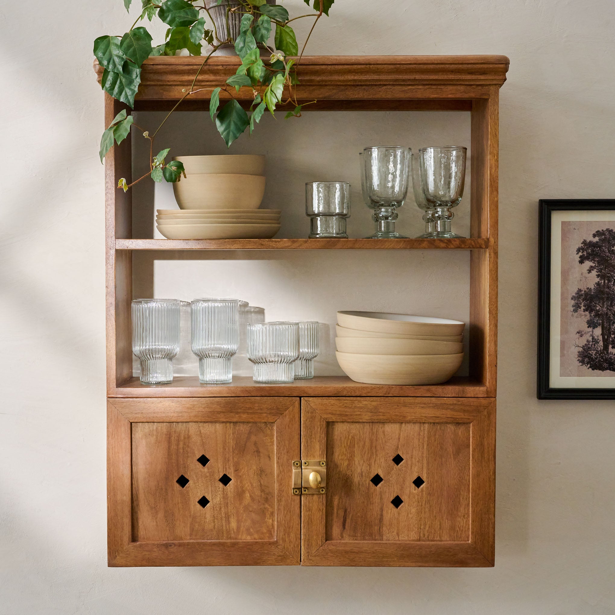 Vaughn Antiqued Wood Shelf with Doors shown with dishes