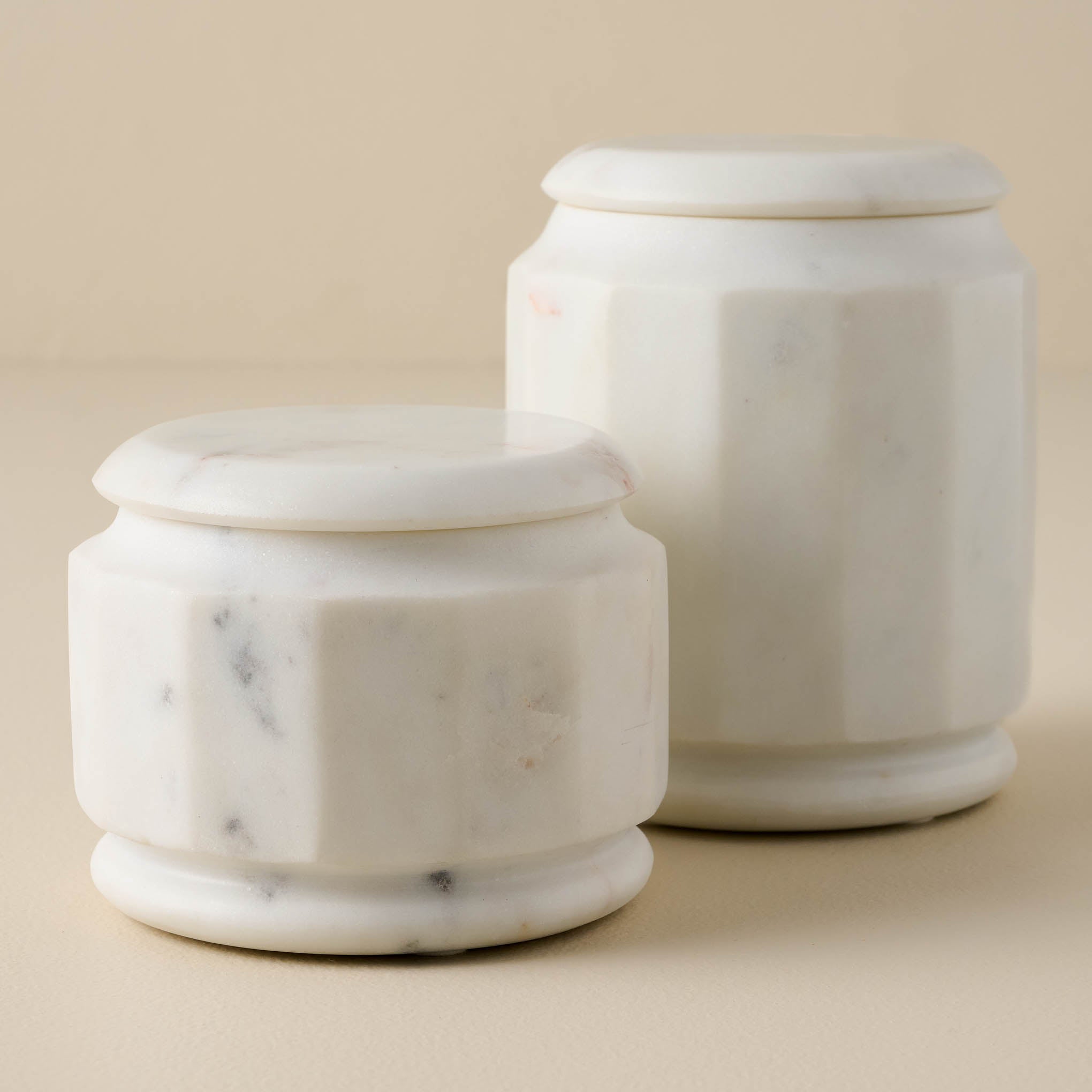 short and tall sized White Marble Canisters Items range from $34.00 to $46.00