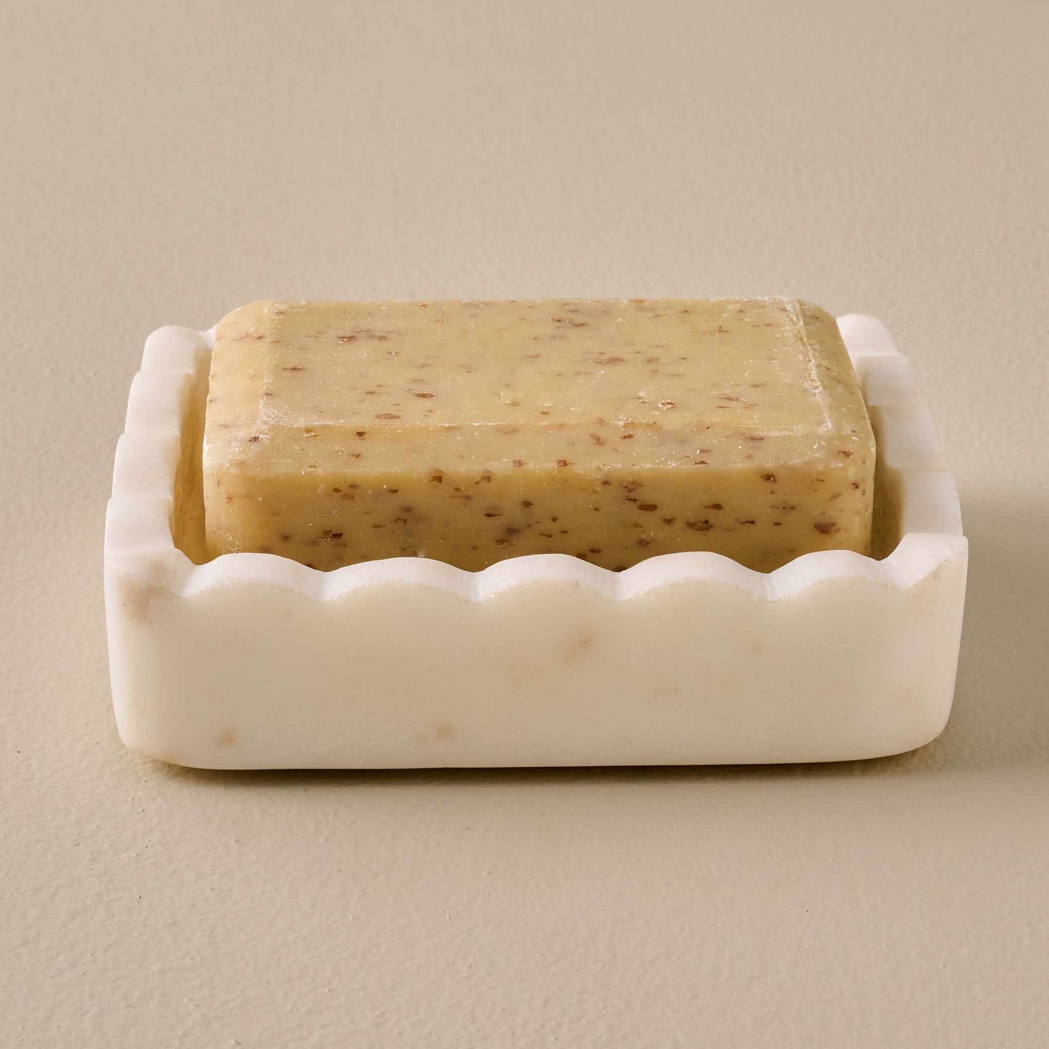 Hand Carved Marble Scalloped Soap Dish shown with bar of soap