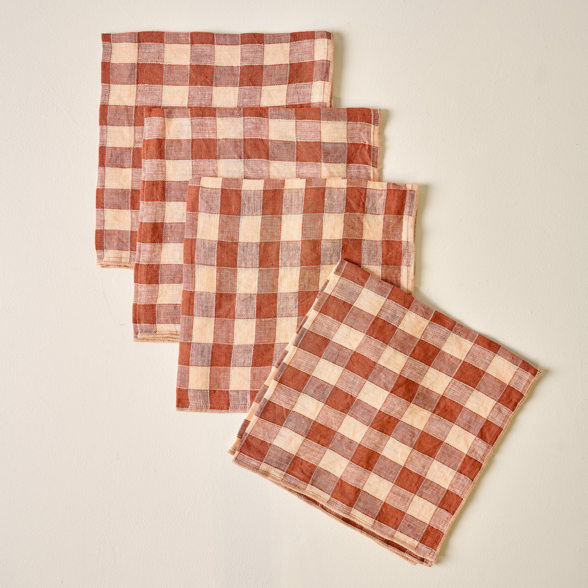 Coral Gingham Napkin Set of Four folded On sale for $24.99, discounted from $42.00
