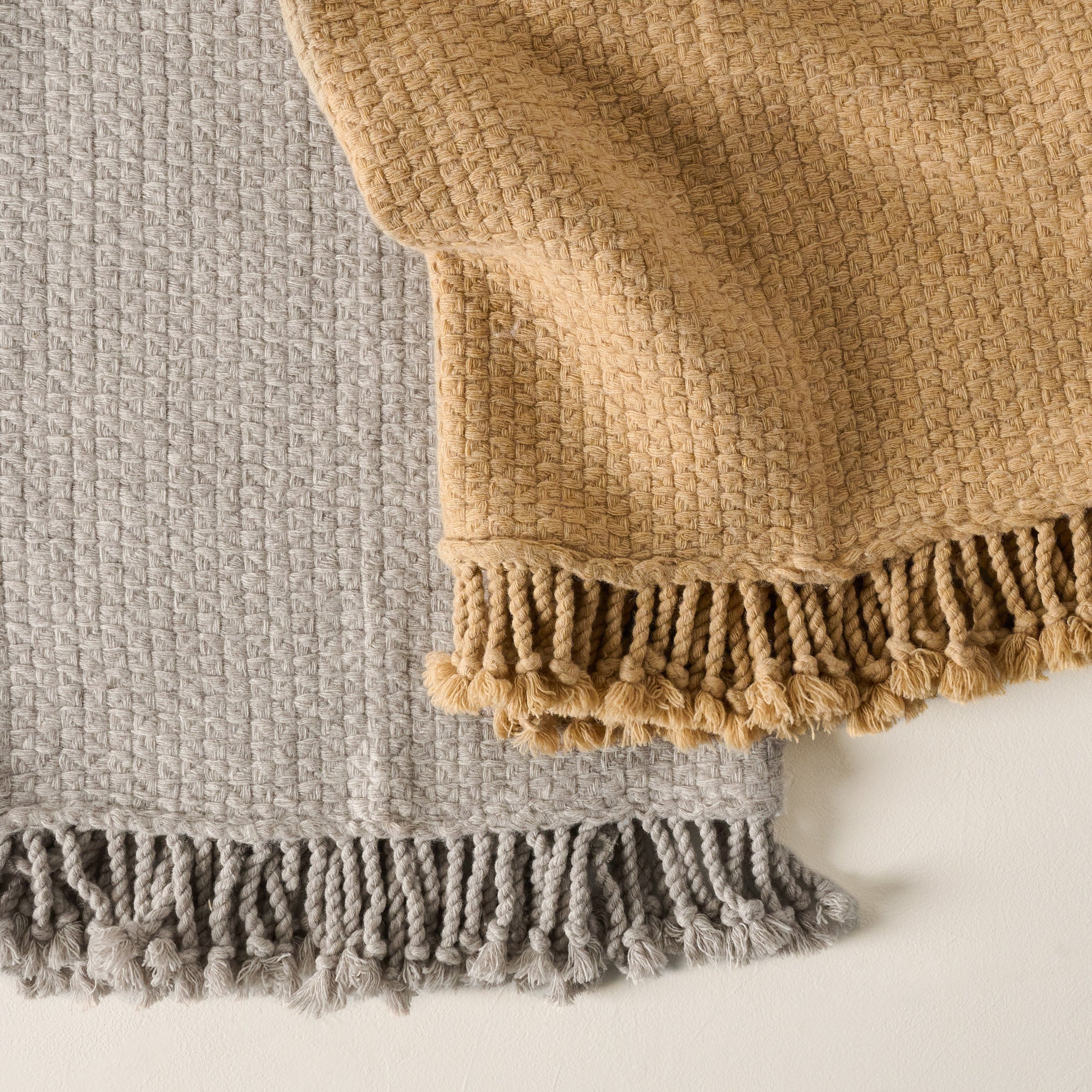 Grey and Ochre Basketweave Throws shown up close On sale for $67.99, discounted from $120.00