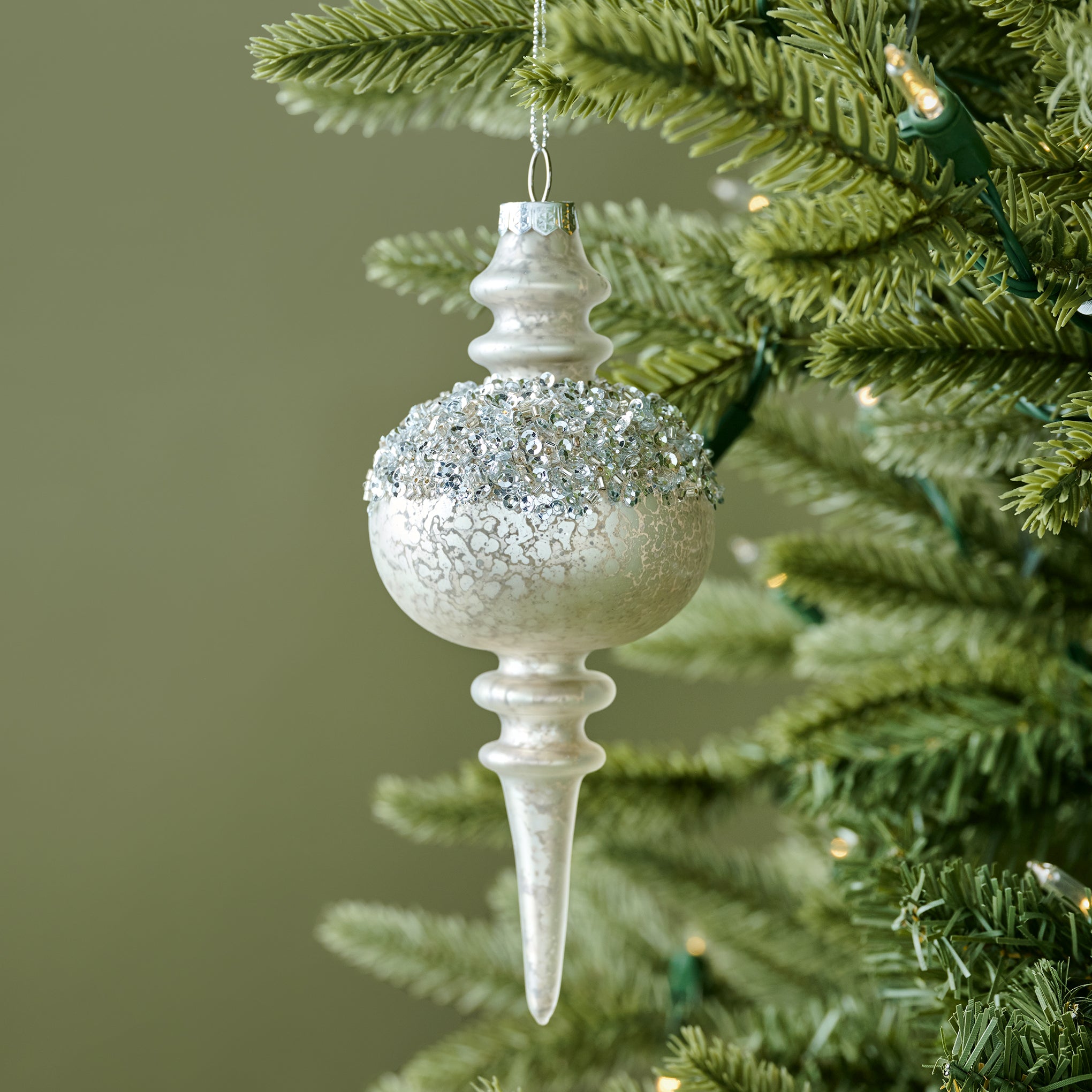 Winter Splendor Finial Ornament shown on tree On sale for $8.49, discounted from $16.00