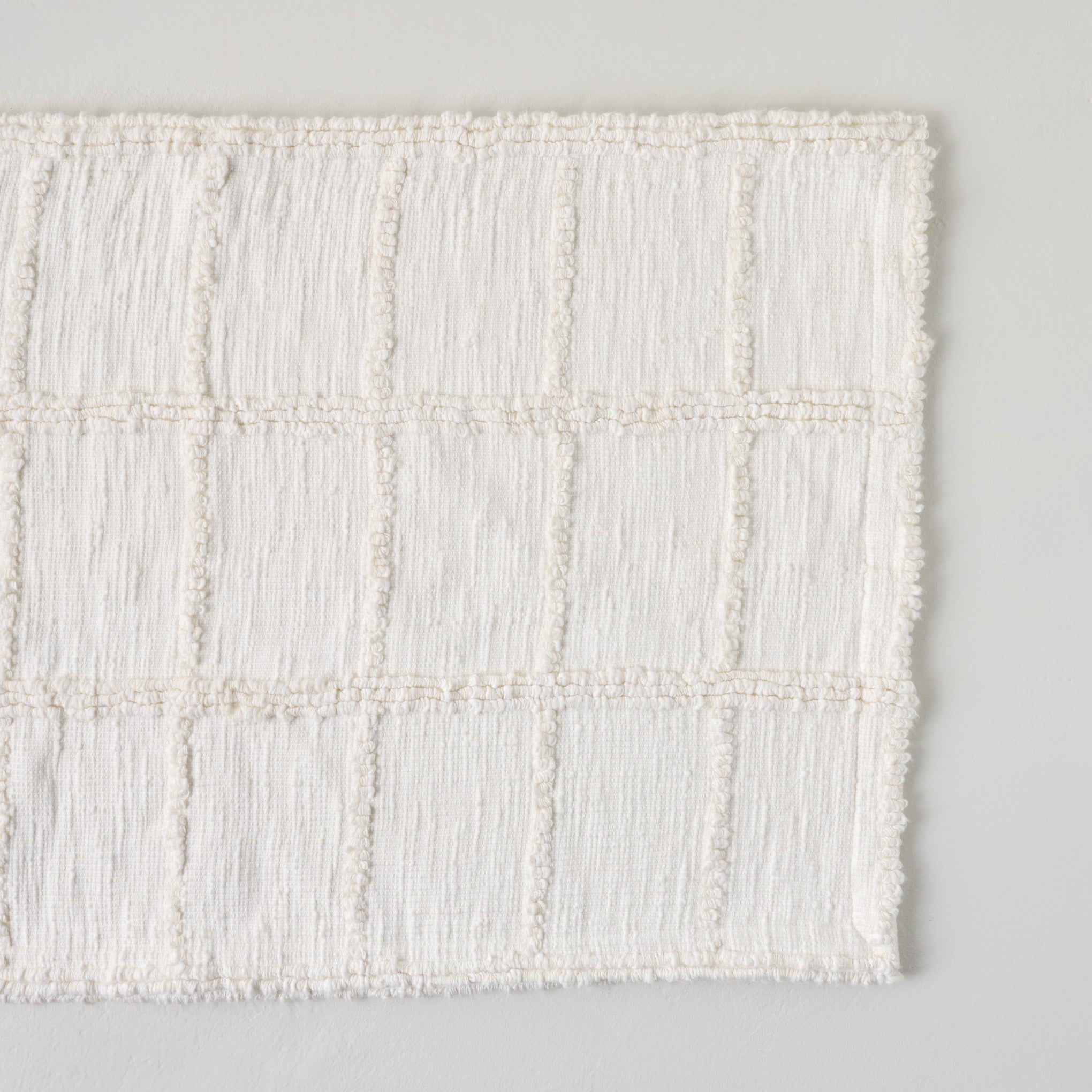 Optic White Textured Bath Mat On sale for $34.99, discounted from $40.00