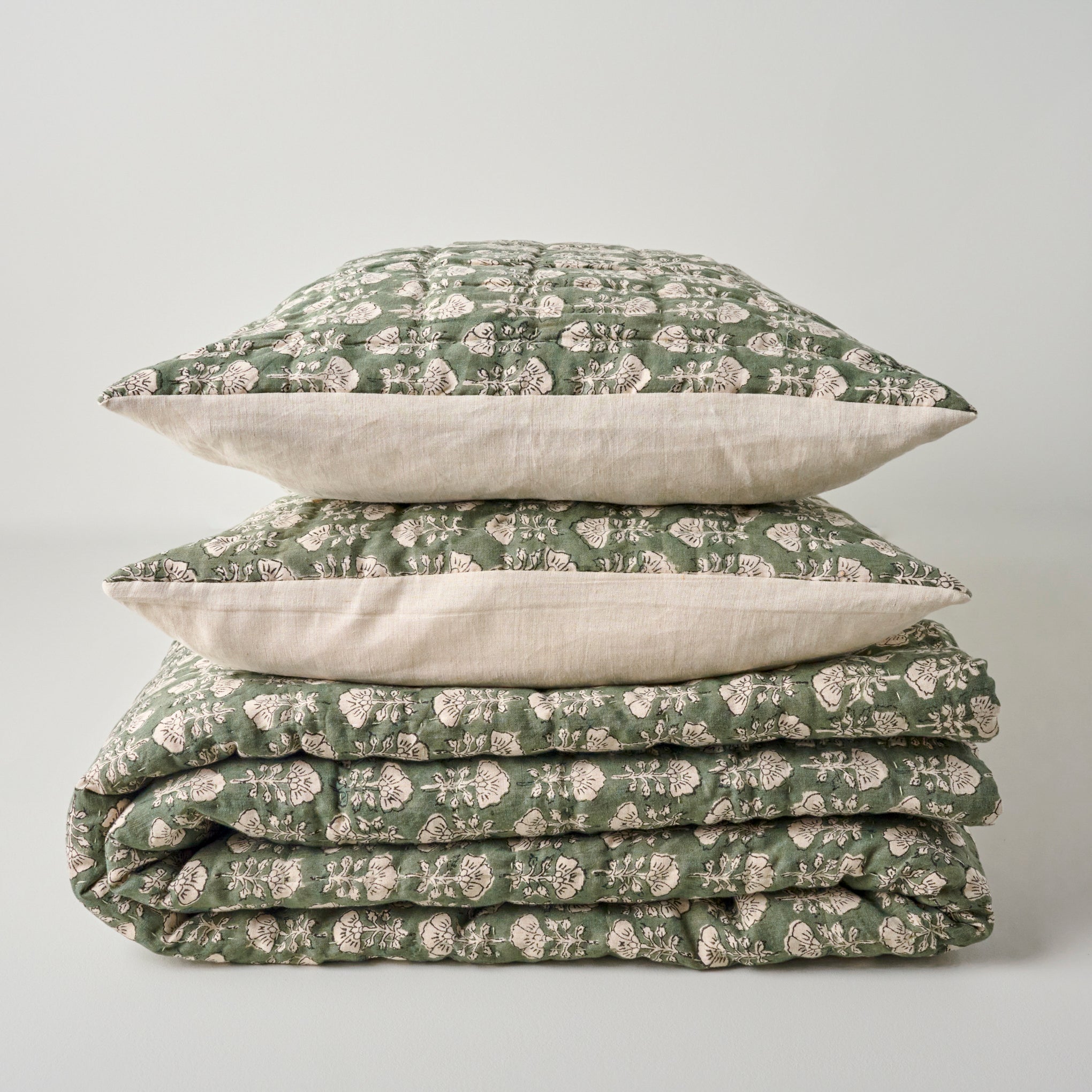 Flora Block Print Quilt - Dusty Green shown with coordinating shams