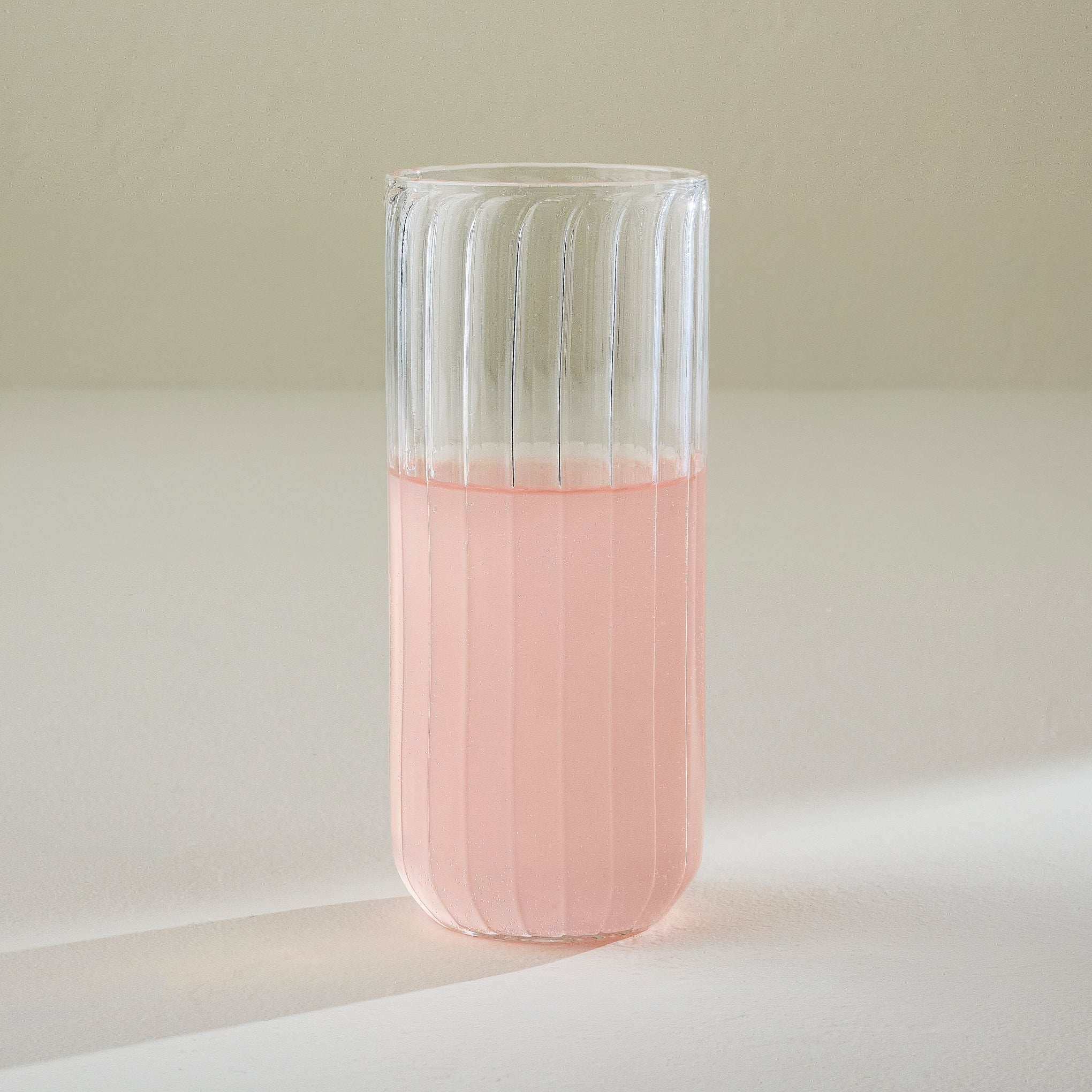 Fluted Glass Tumbler shown with drink $14.00