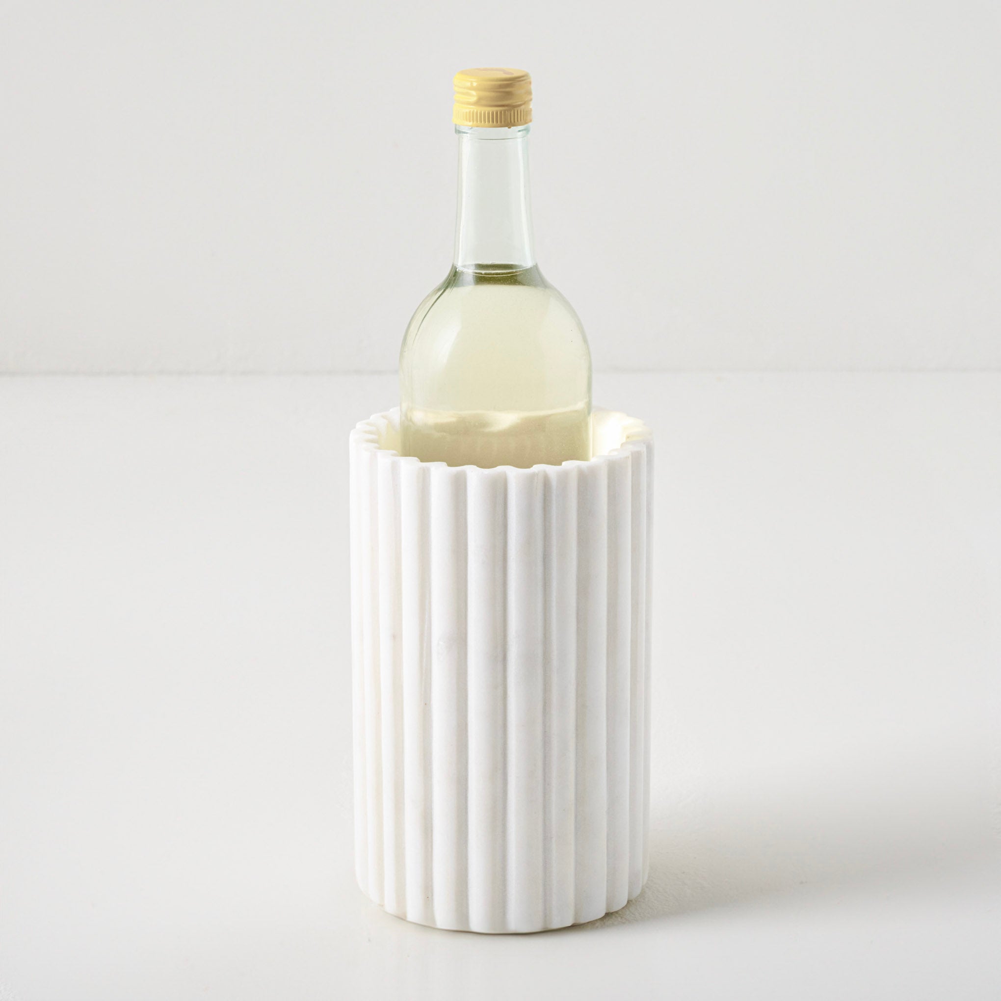Fluted Marble Crock shown with bottle On sale for $29.99, discounted from $48.00