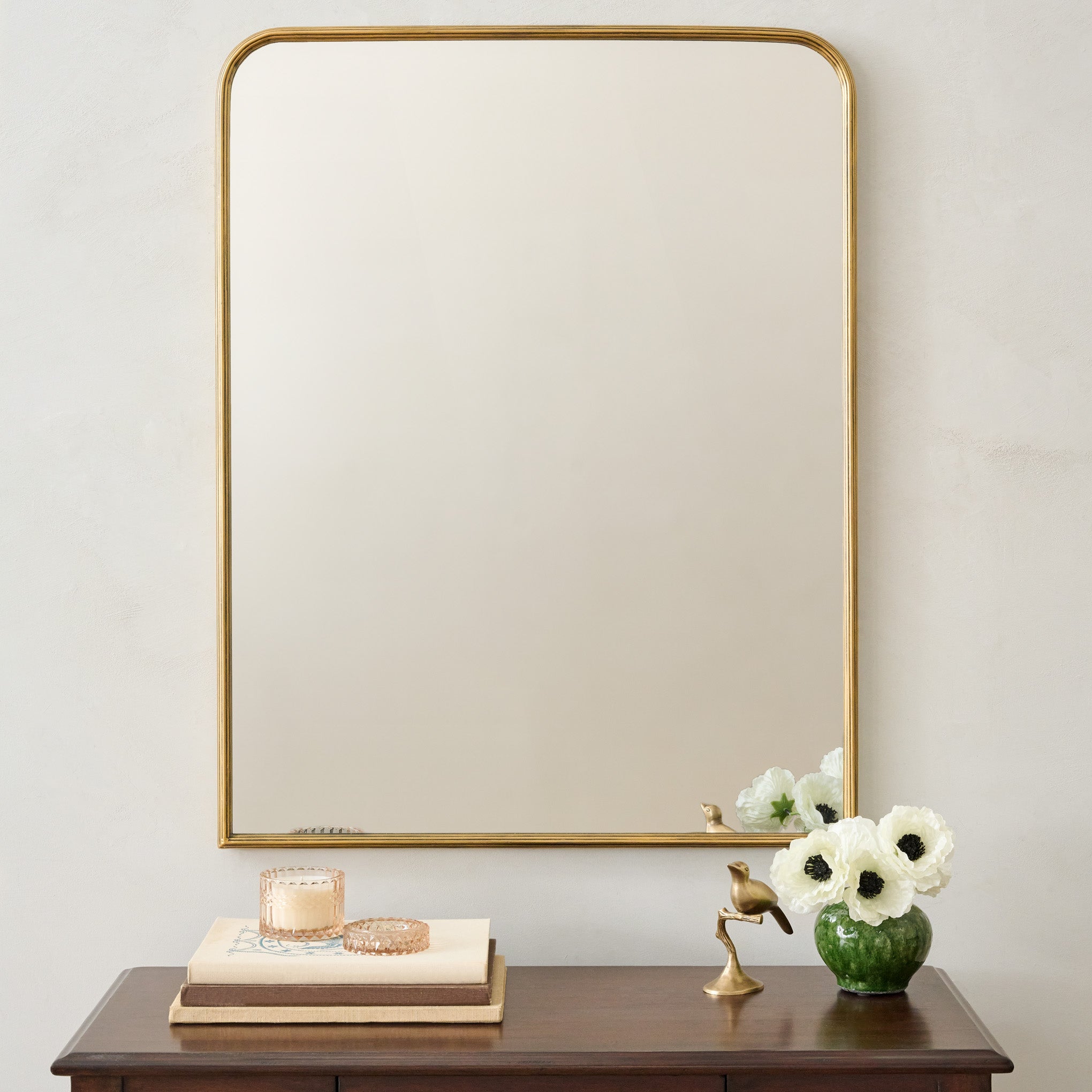 Collin Ribbed Brass Vanity Mirror shown above vanity $148.00