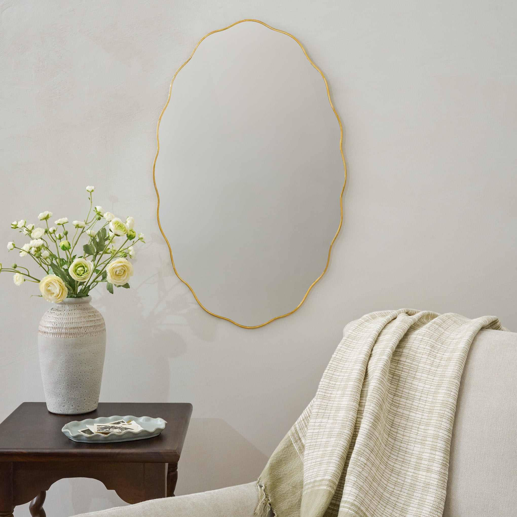 Jane Brass Scalloped Framed Mirror shown above chair 